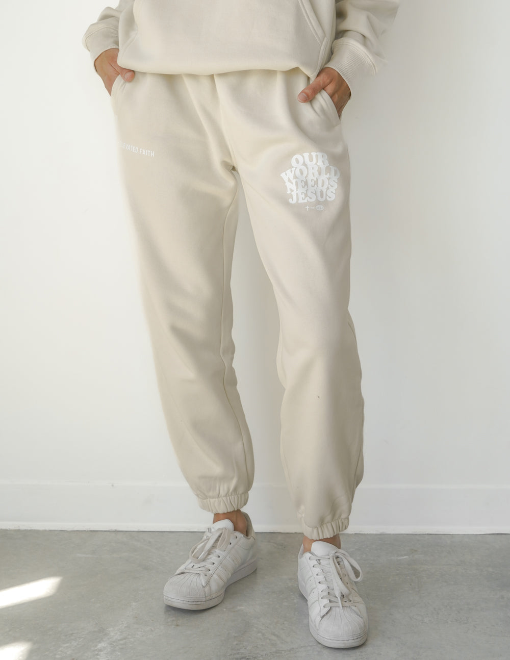 Elevated Faith Our World Needs Jesus Beige Unisex Sweatpant — side view