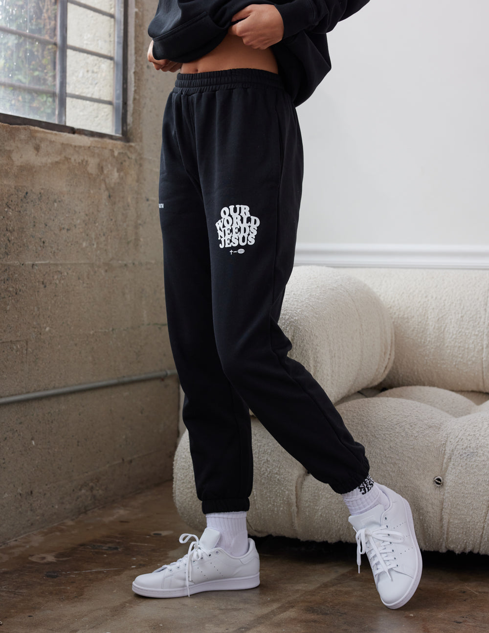 Elevated Faith Our World Needs Jesus Black Unisex Sweatpant — lifestyle context