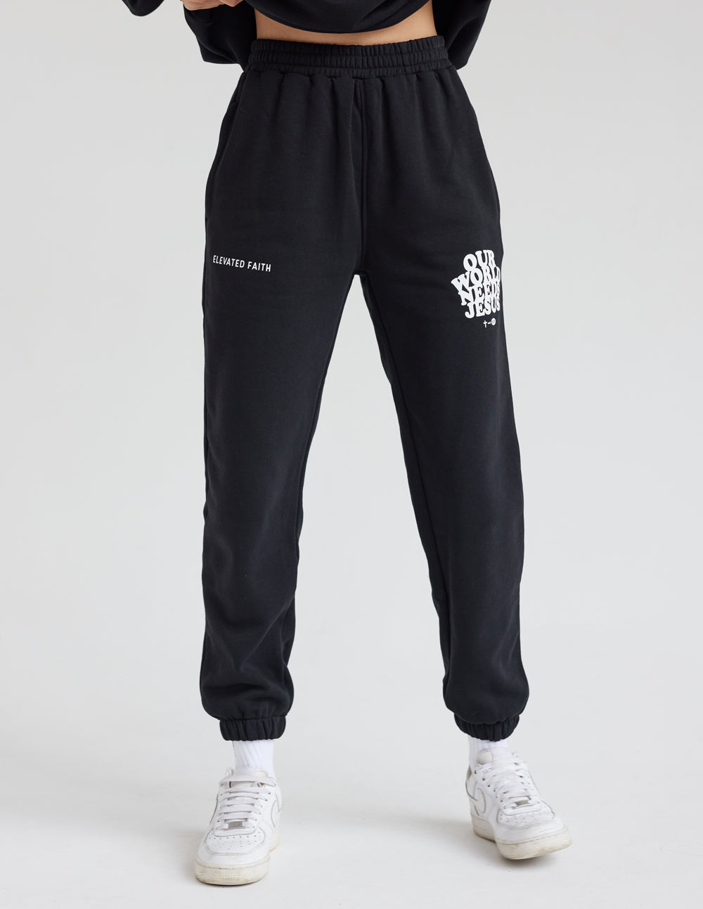 Elevated Faith Our World Needs Jesus Black Unisex Sweatpant — back view