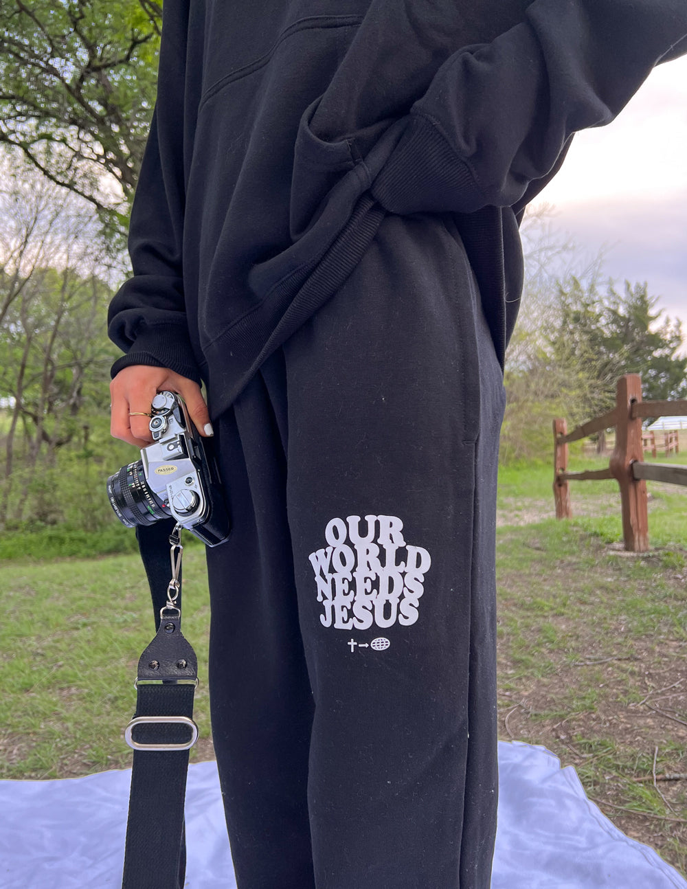 Elevated Faith Our World Needs Jesus Black Unisex Sweatpant — detail close-up