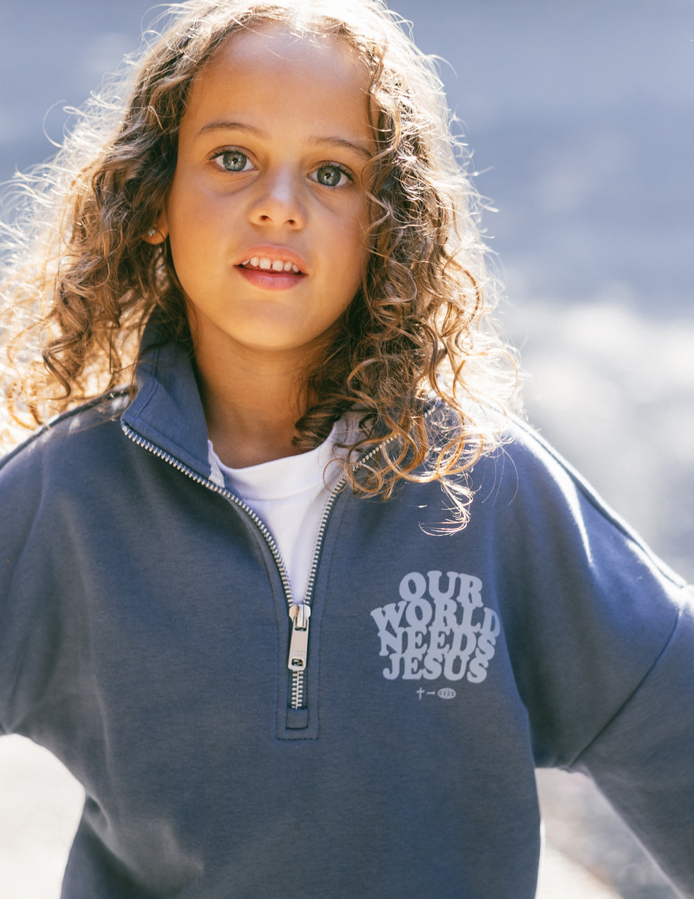 Elevated Faith Our World Needs Jesus Kids Half-Zip — kids jacket category context