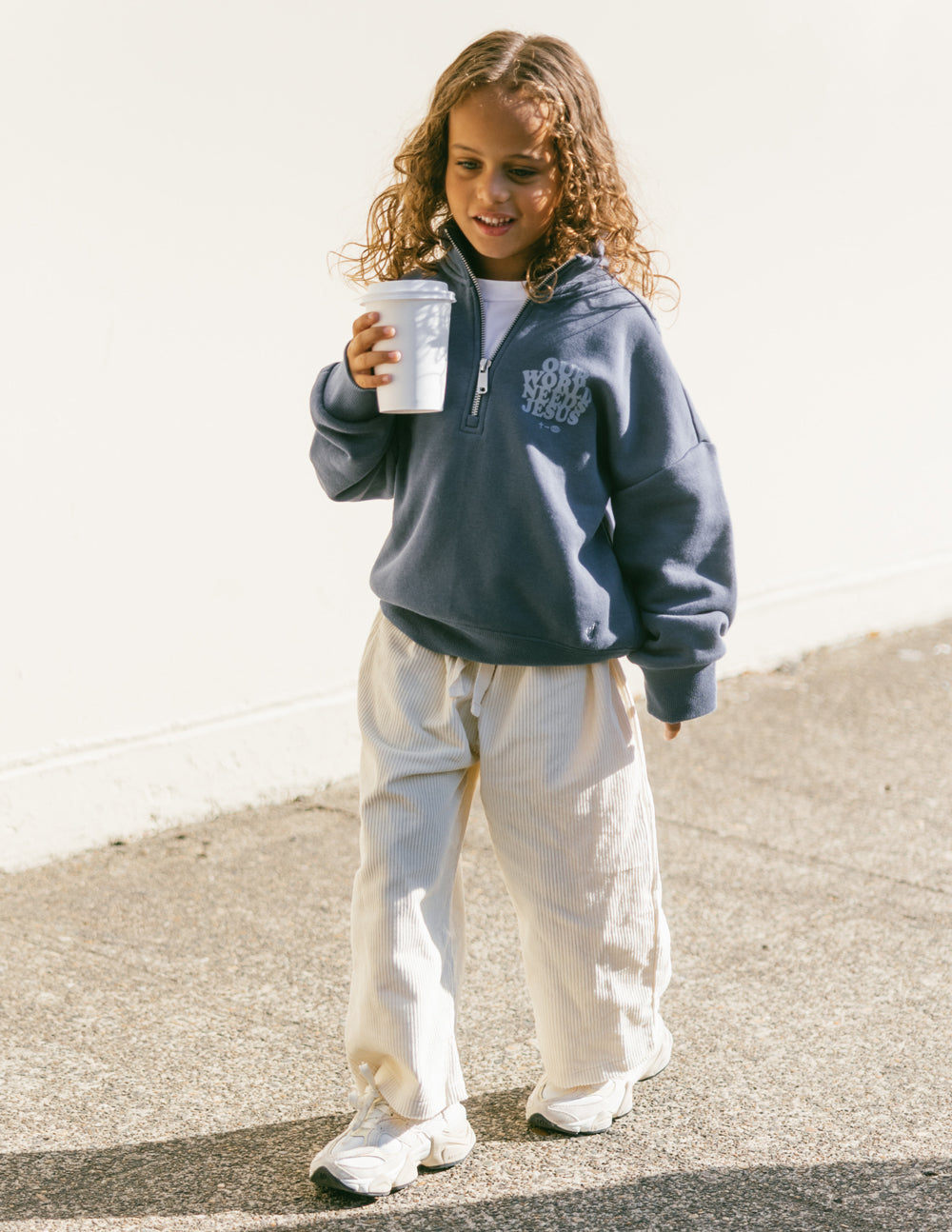 Elevated Faith Our World Needs Jesus Kids Half-Zip — construction detail