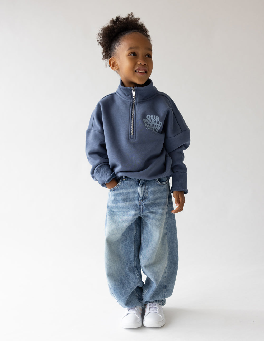 Elevated Faith Our World Needs Jesus Kids Half-Zip — lifestyle worn / used context