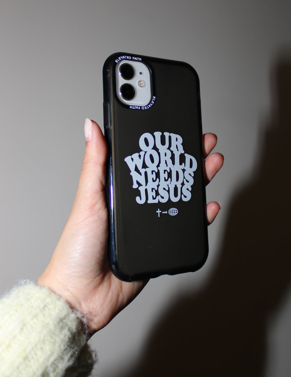 Elevated Faith Our World Needs Jesus Phone Case — side view