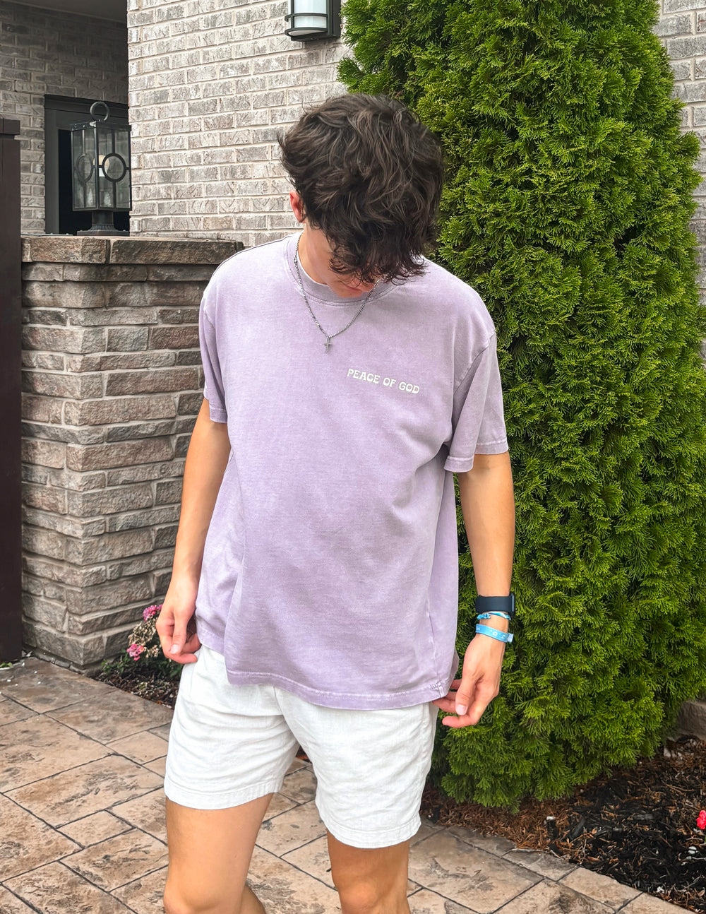 Elevated Faith Peace of God Unisex Tee — lifestyle worn / used context
