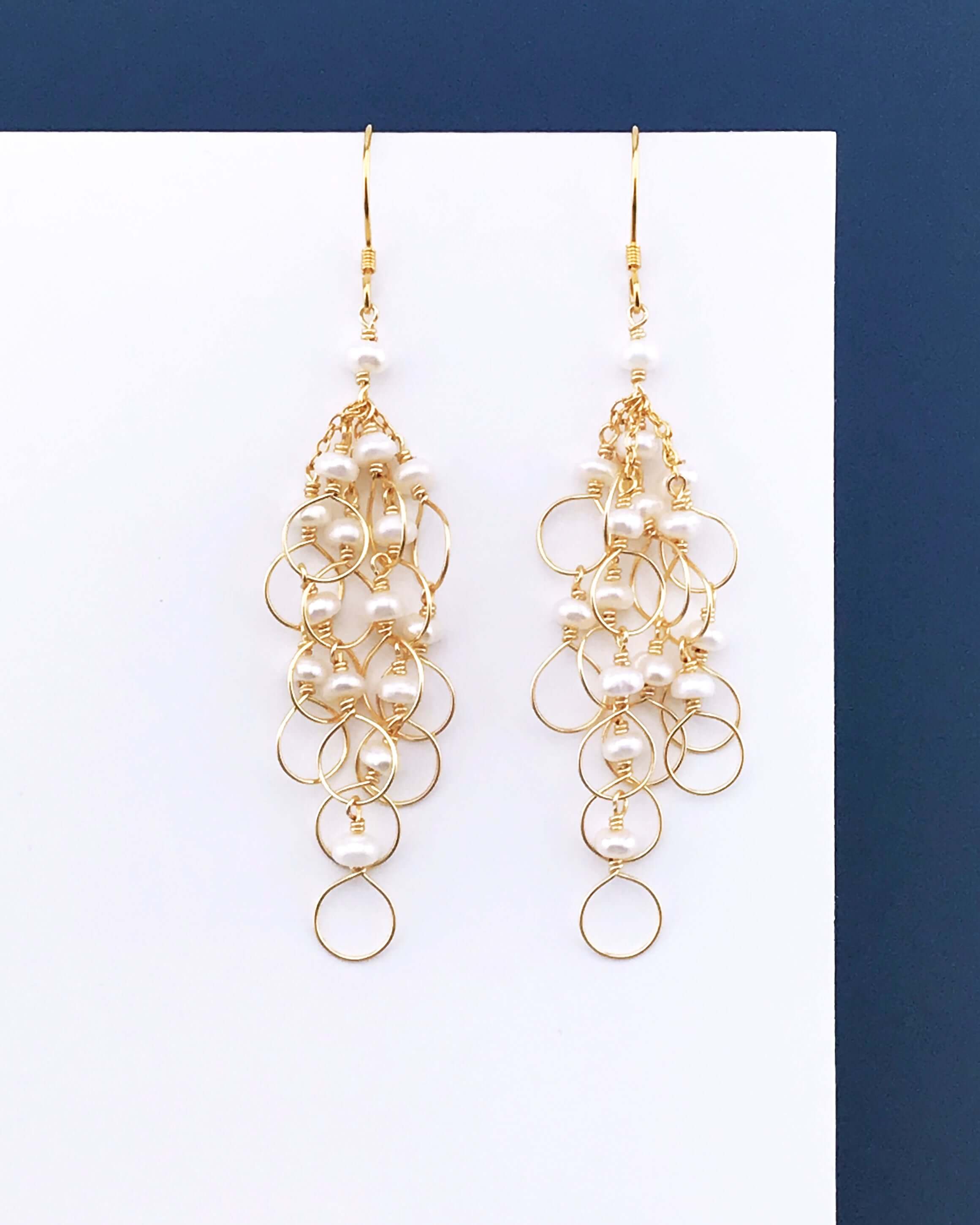 PARKEN JEWELRY Pearl Gold Chain Loop Earrings — lifestyle context