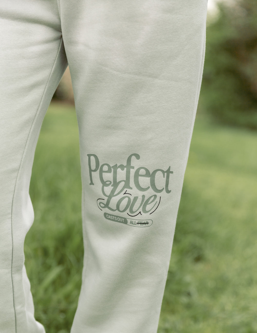 Elevated Faith Perfect Love Unisex Sweatpant — Elevated Faith branding close-up
