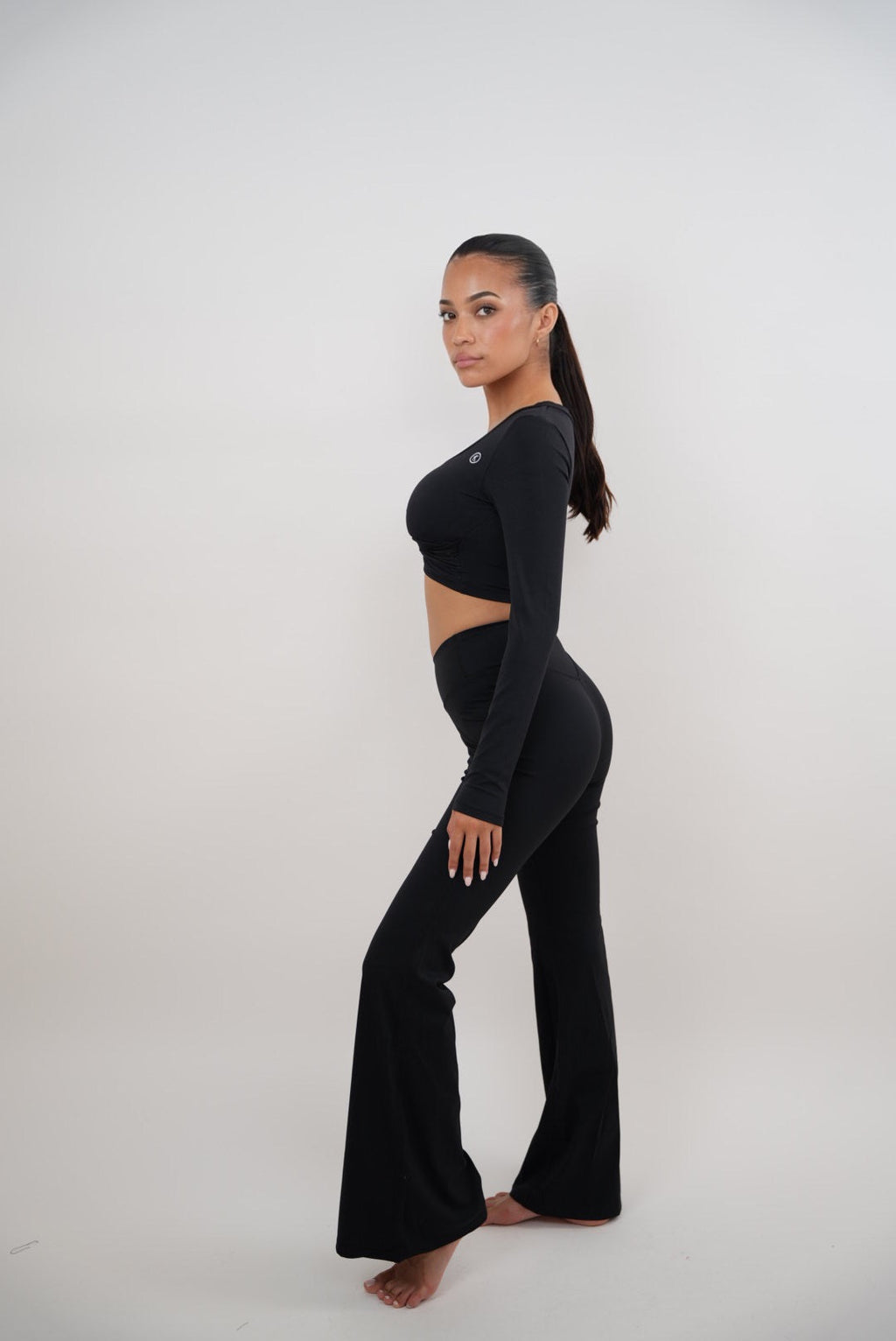 KIMITH BRAND I Am Present Black Stretch Flare Legging — side view