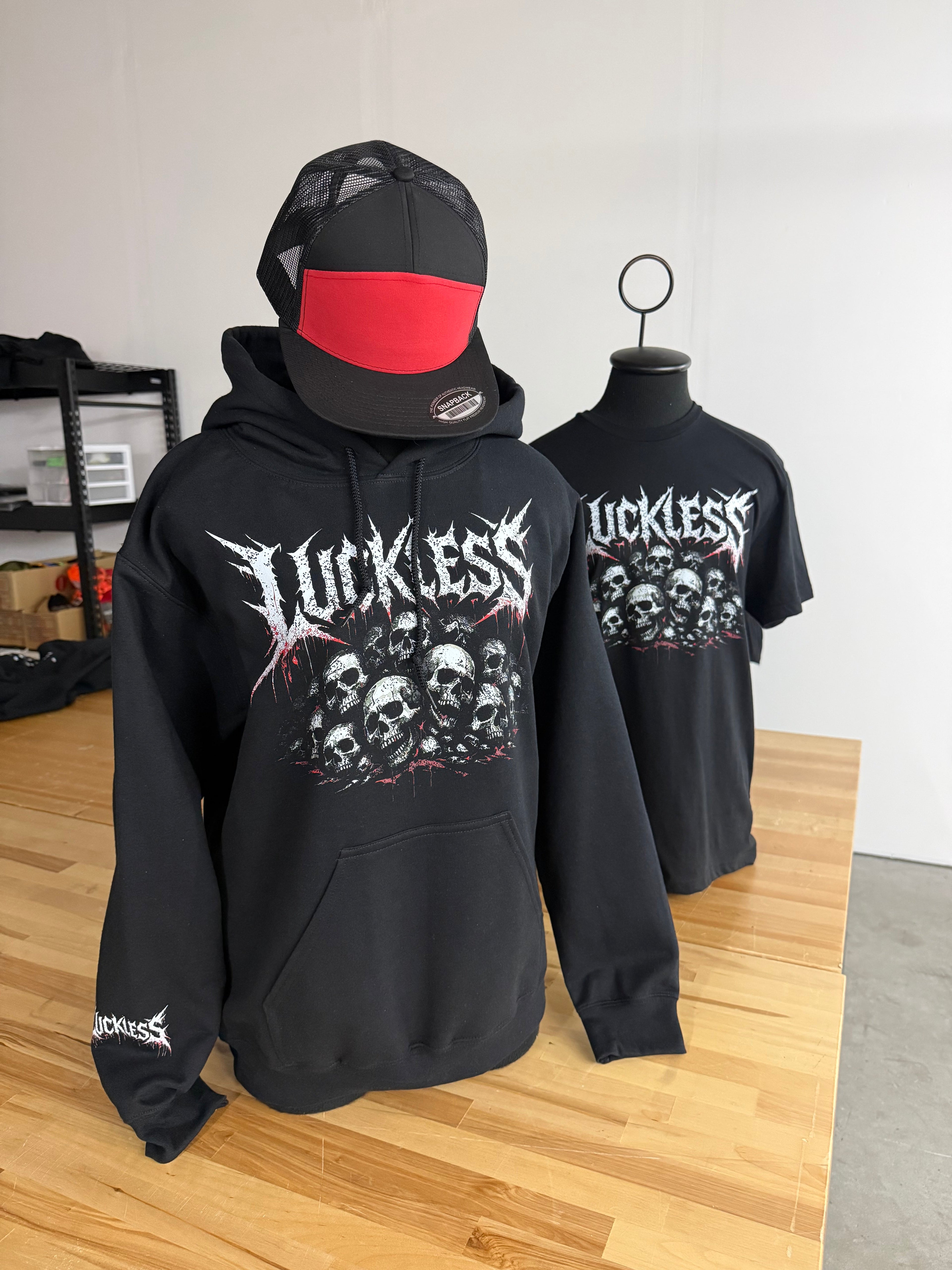 Luckless Outfitters Pile of Skulls Tee — size reference