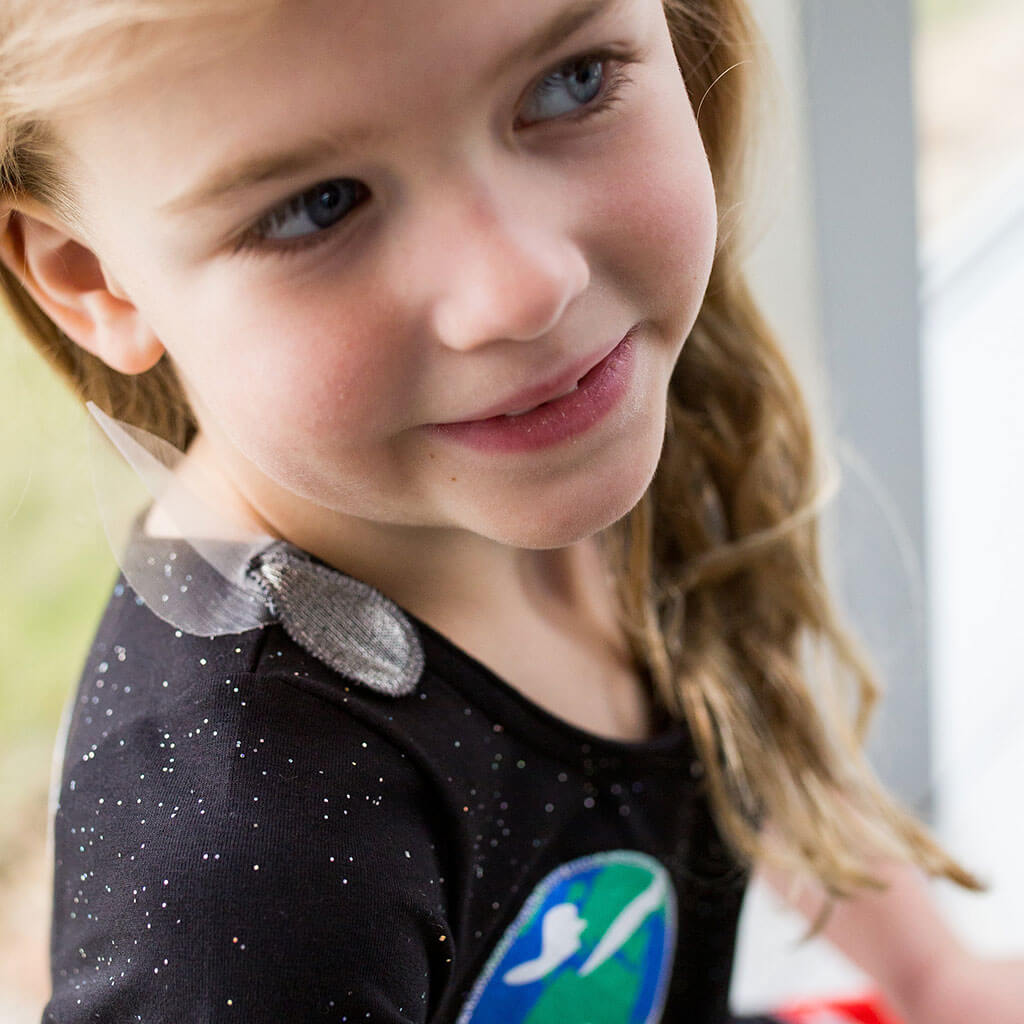 Princess Awesome & Boy Wonder Solar System Busy Dress — Princess Awesome & Boy Wonder branding close-up