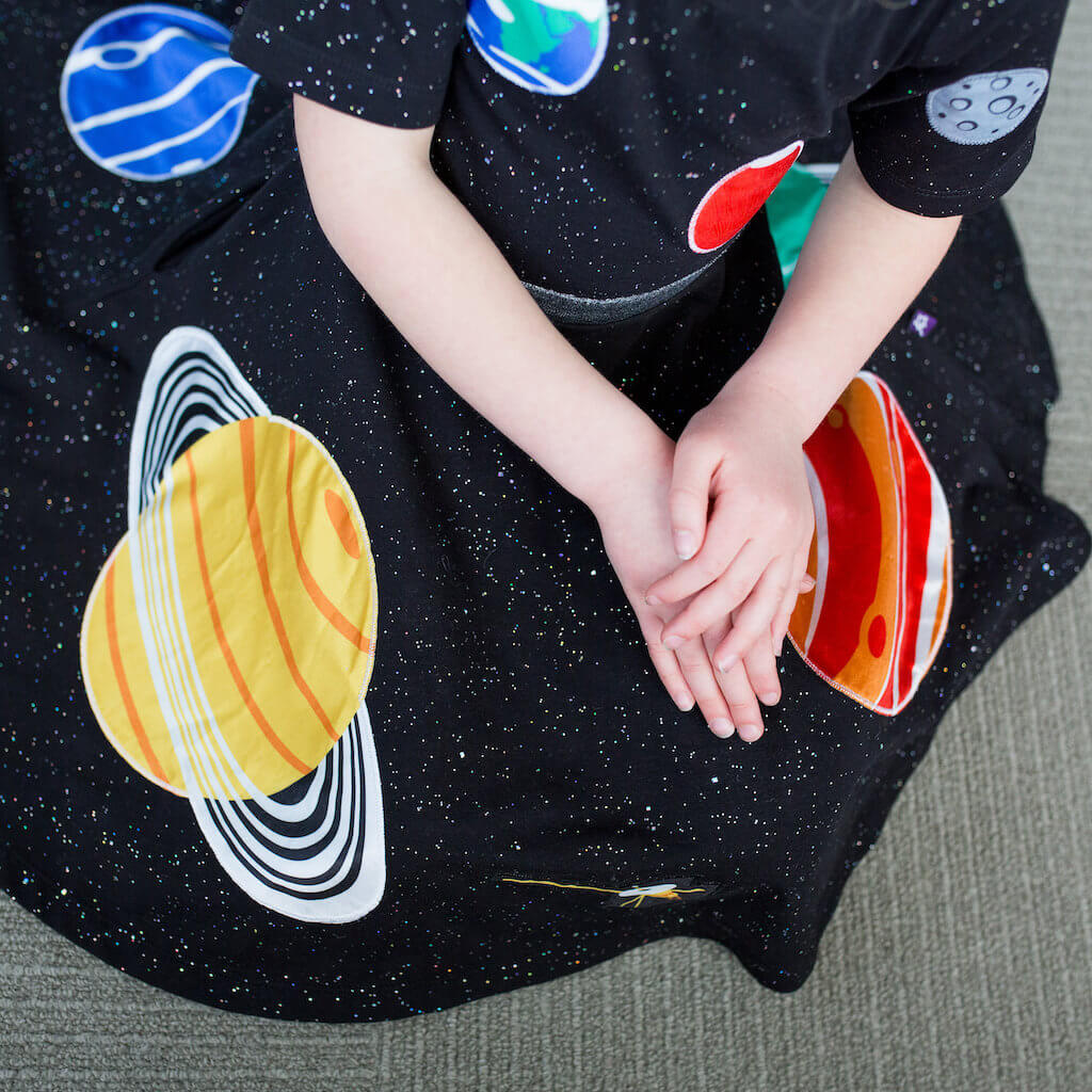 Princess Awesome & Boy Wonder Solar System Busy Dress — lifestyle worn / used context