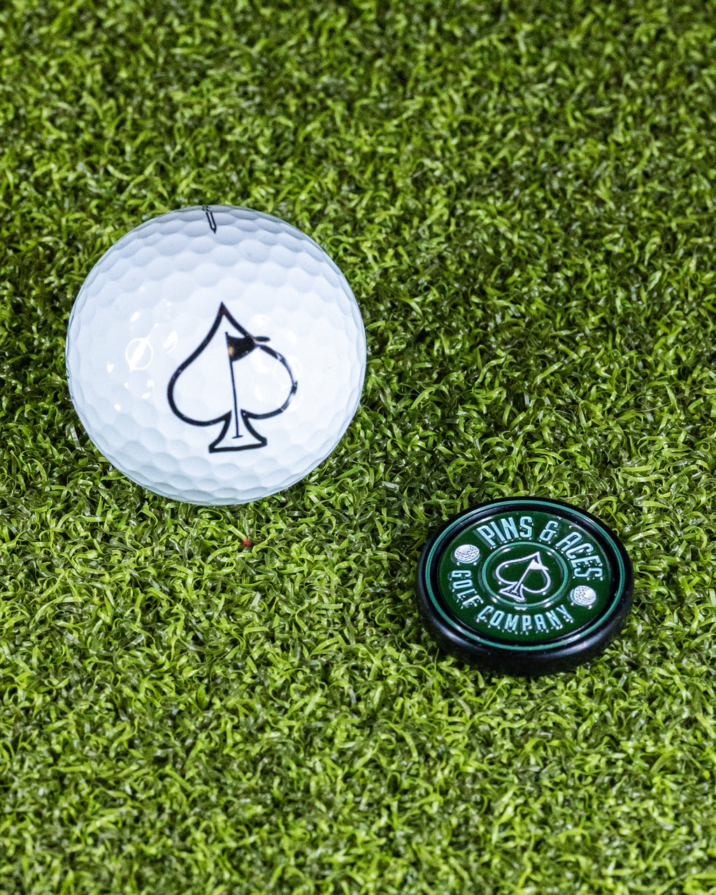 Pins and Aces Pop Out Medallion Ball Marker - Green — fabric or material detail