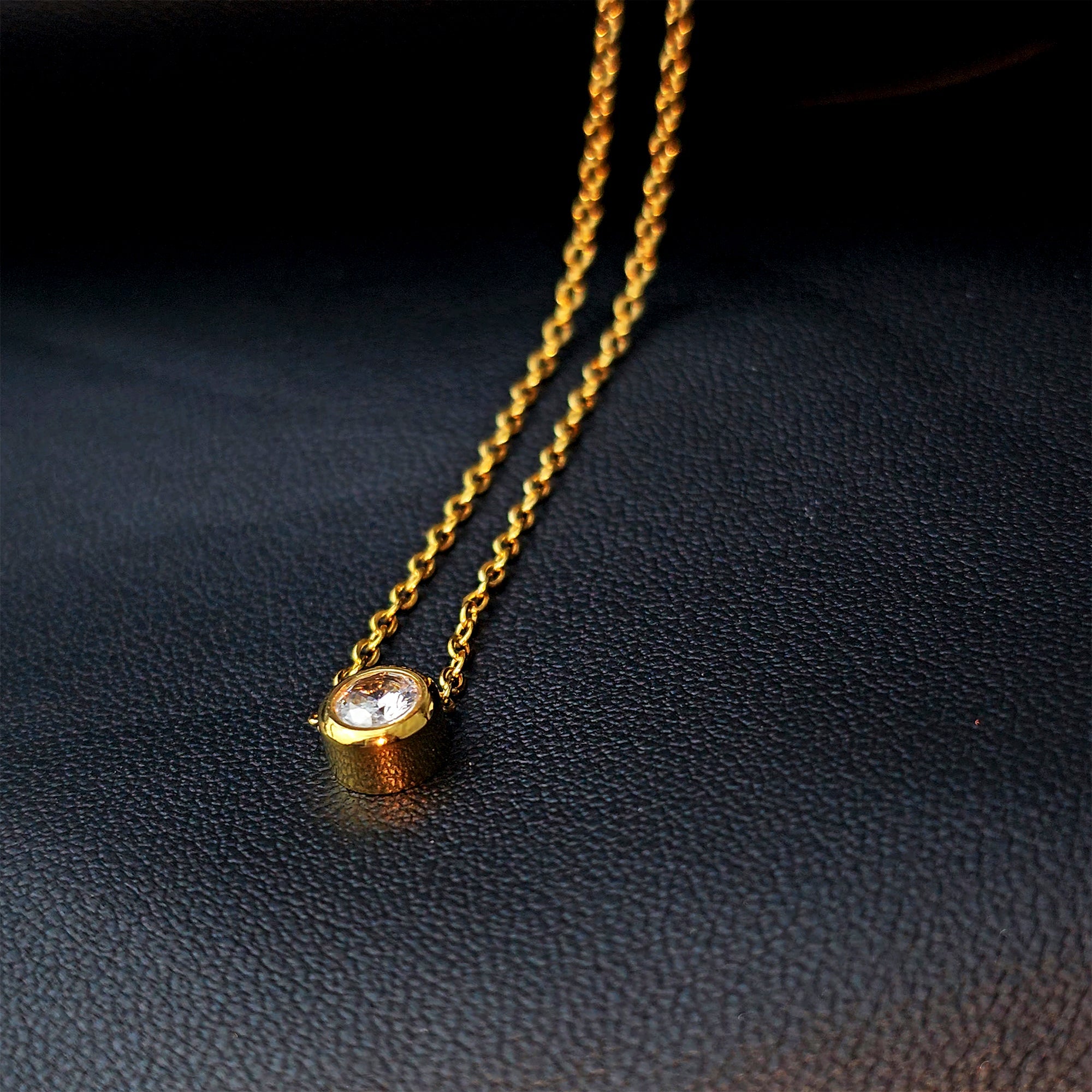 BodyCandy Stainless Steel Gold Tone PVD Chain Dainty Bezel CZ Pendant Necklace — detail close-up