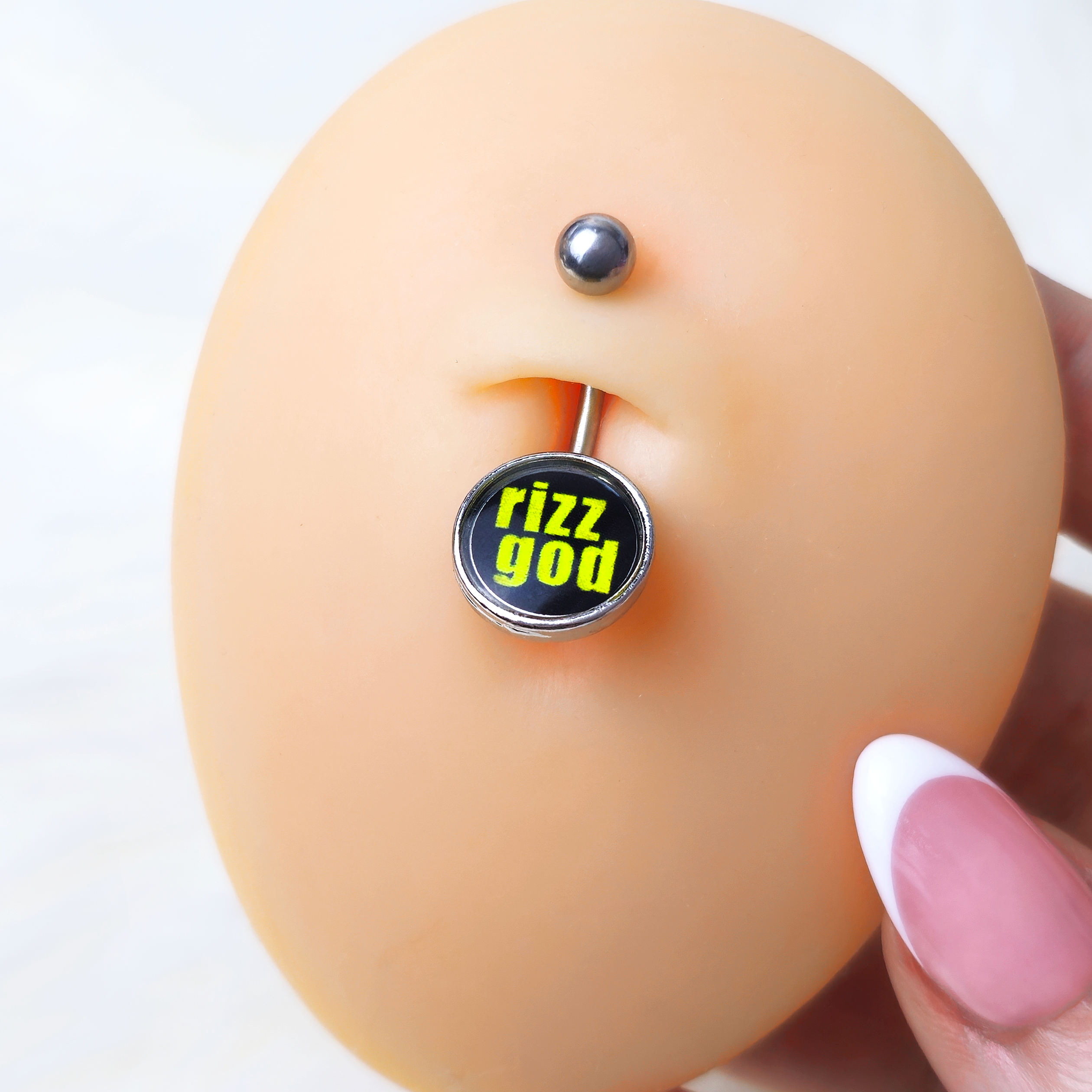 BodyCandy RIZZ GOD Belly Ring by Onyx O — detail close-up