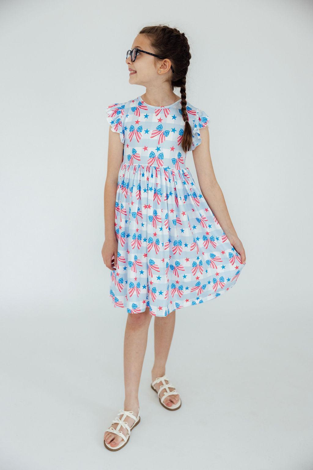 Mila & Rose ® Red, White & Bows Flutter Sleeve Twirl Dress — back view