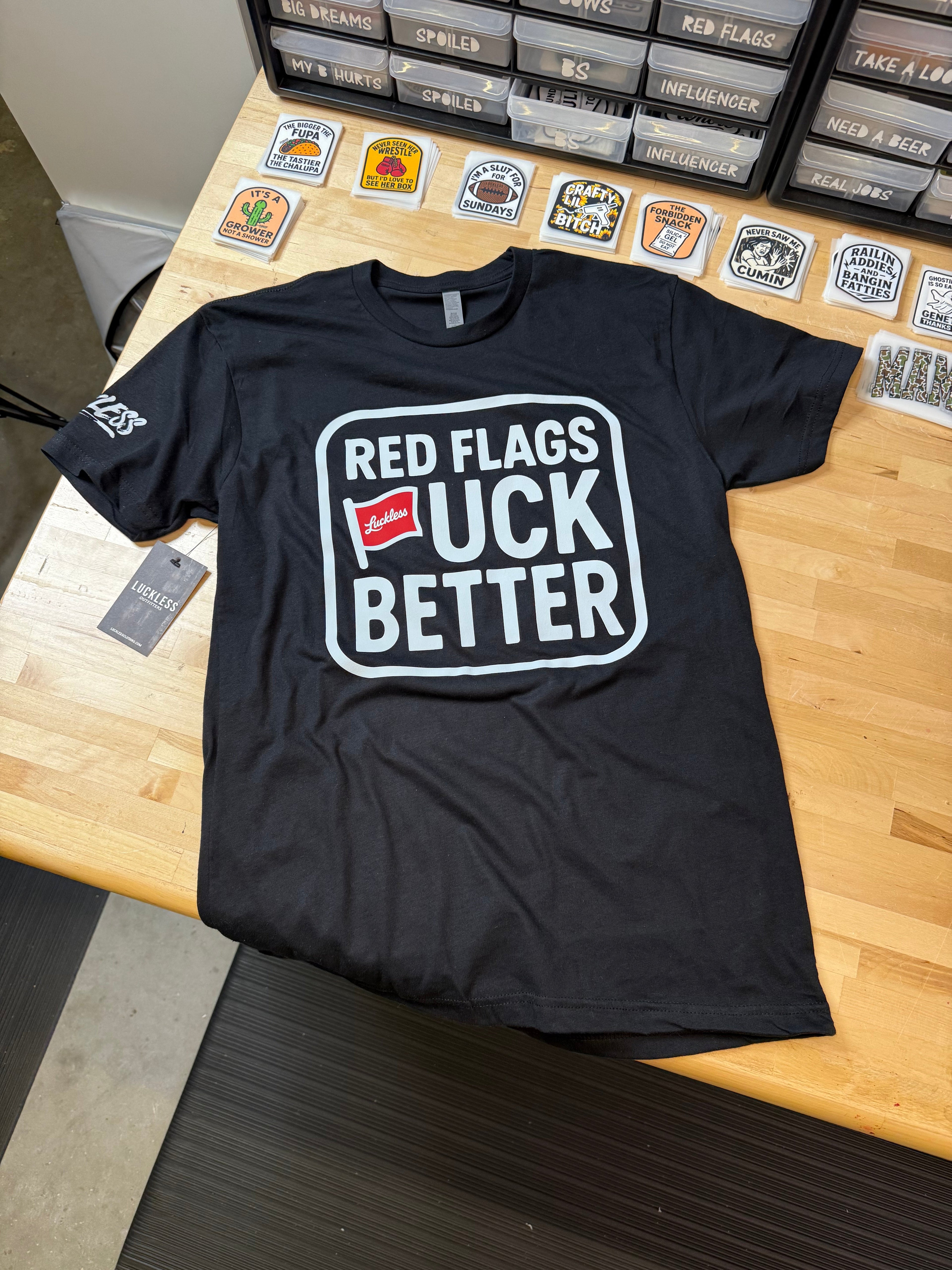 Luckless Outfitters Red Flags Fuck Better Tee — side view