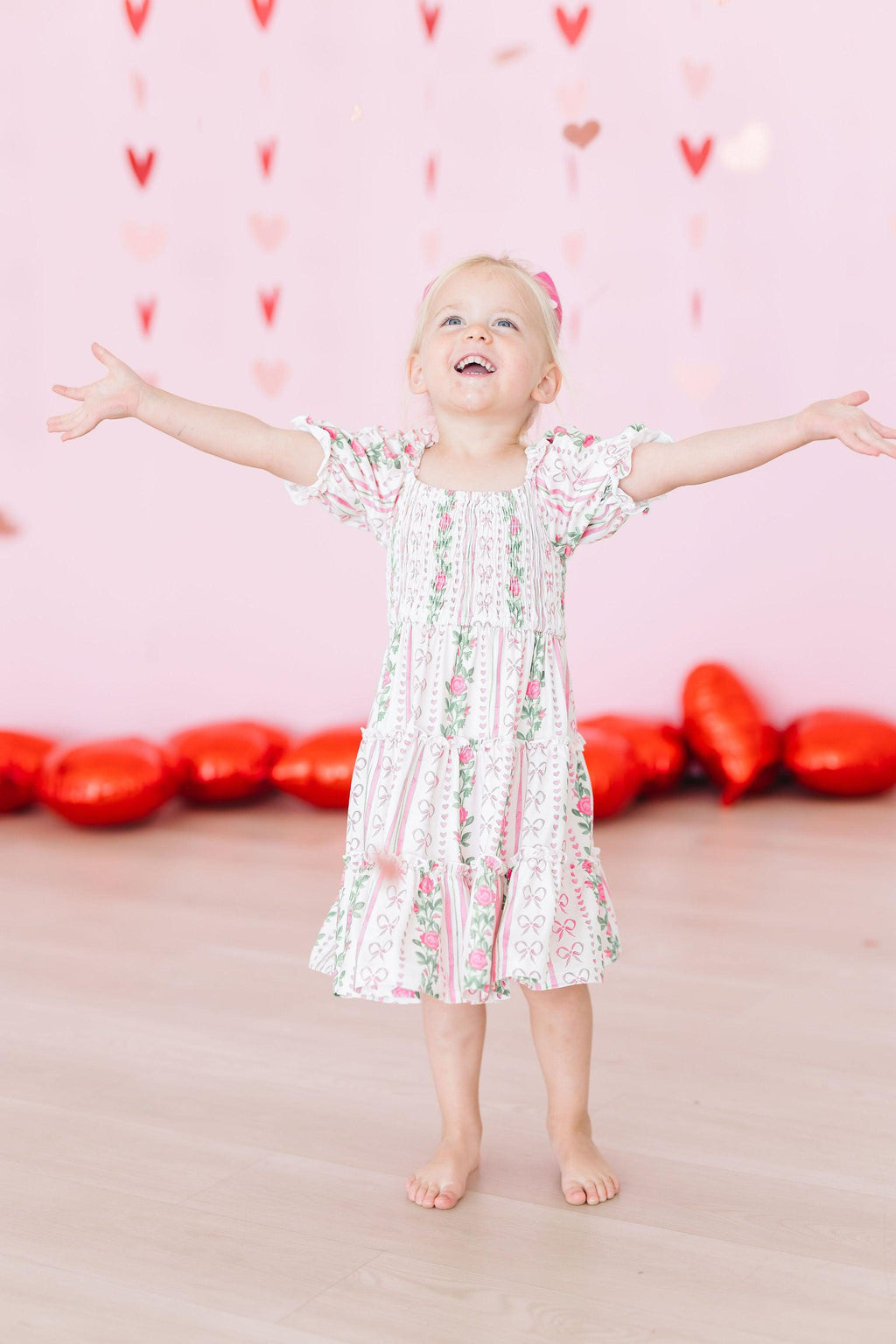 Mila & Rose ® Rosebud Bows Smocked Ruffle Dress — in-use photo