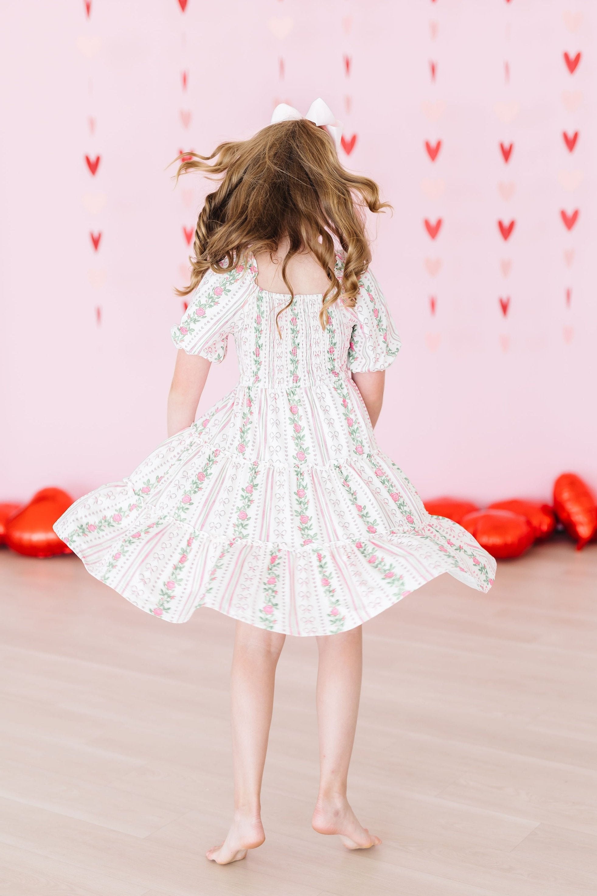 Mila & Rose ® Rosebud Bows Smocked Ruffle Dress — side view