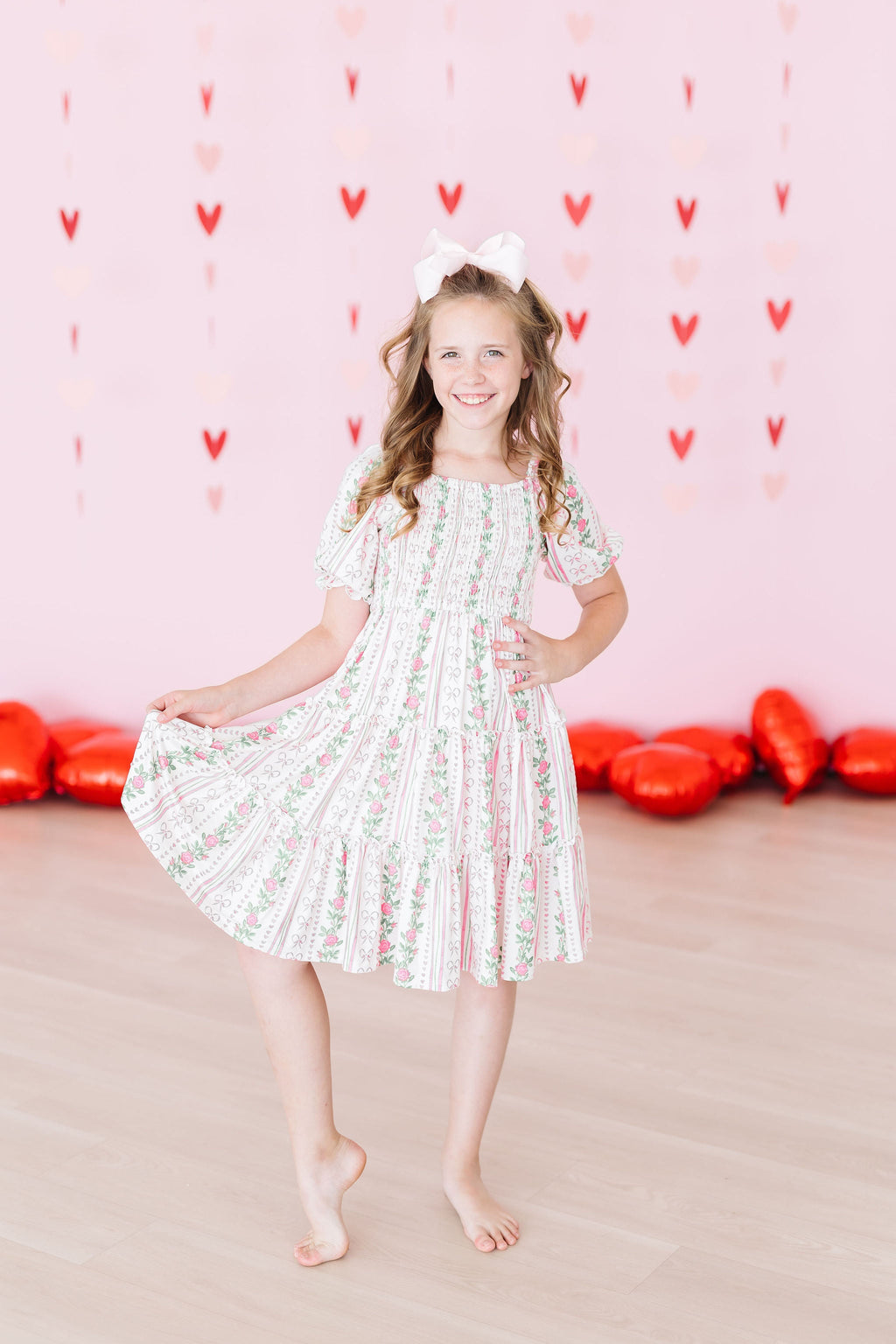 Mila & Rose ® Rosebud Bows Smocked Ruffle Dress — back view