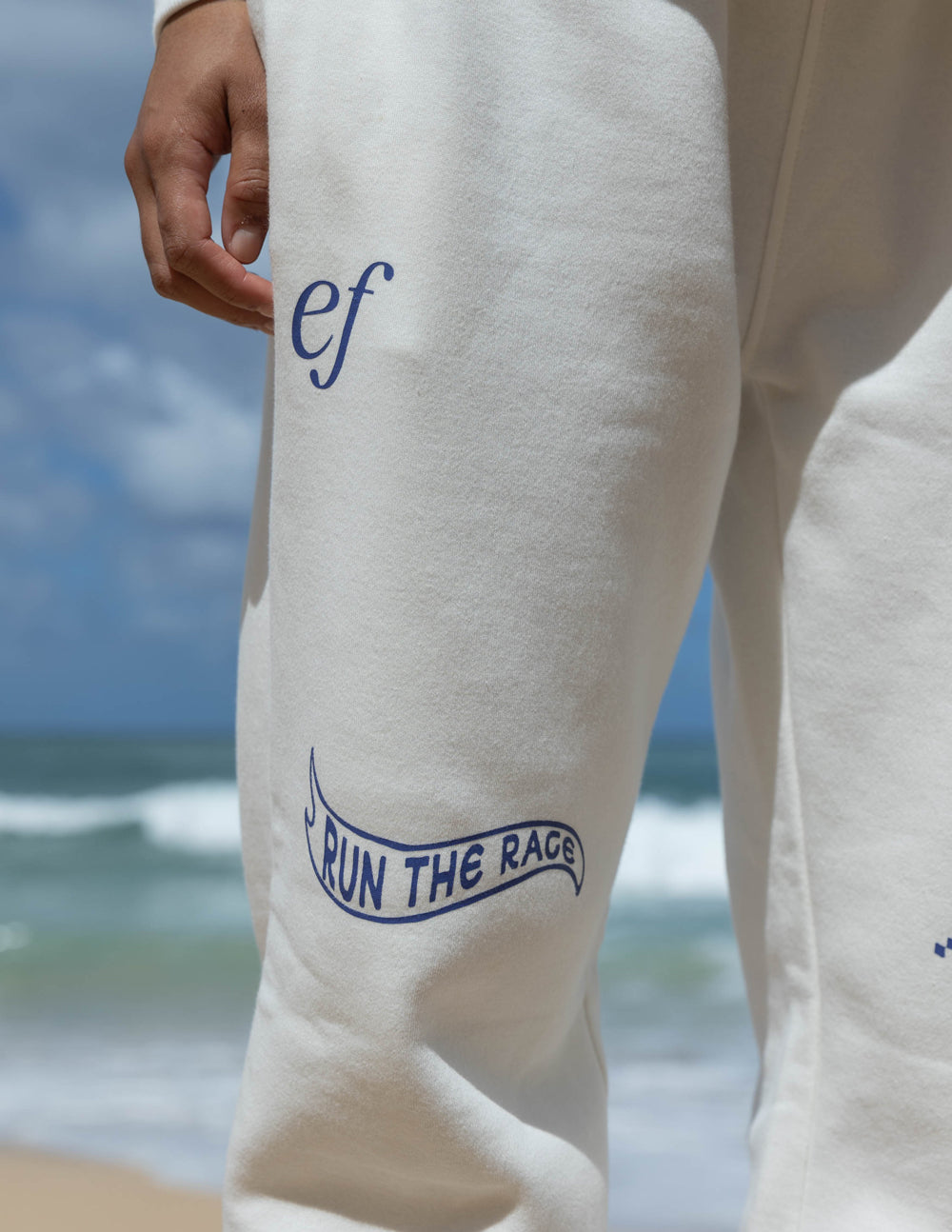 Elevated Faith Run the Race Unisex Sweatpant — Elevated Faith branding close-up