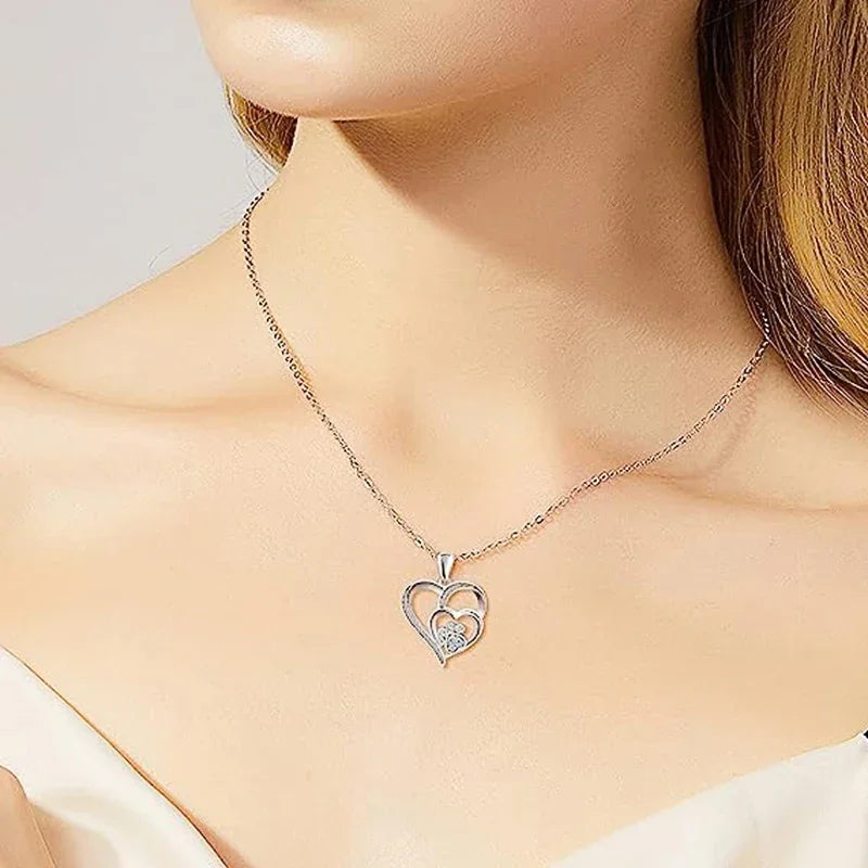 SORI STYLE Elegant Paw Shaped Double Heart CZ Pendant Necklace — lifestyle context