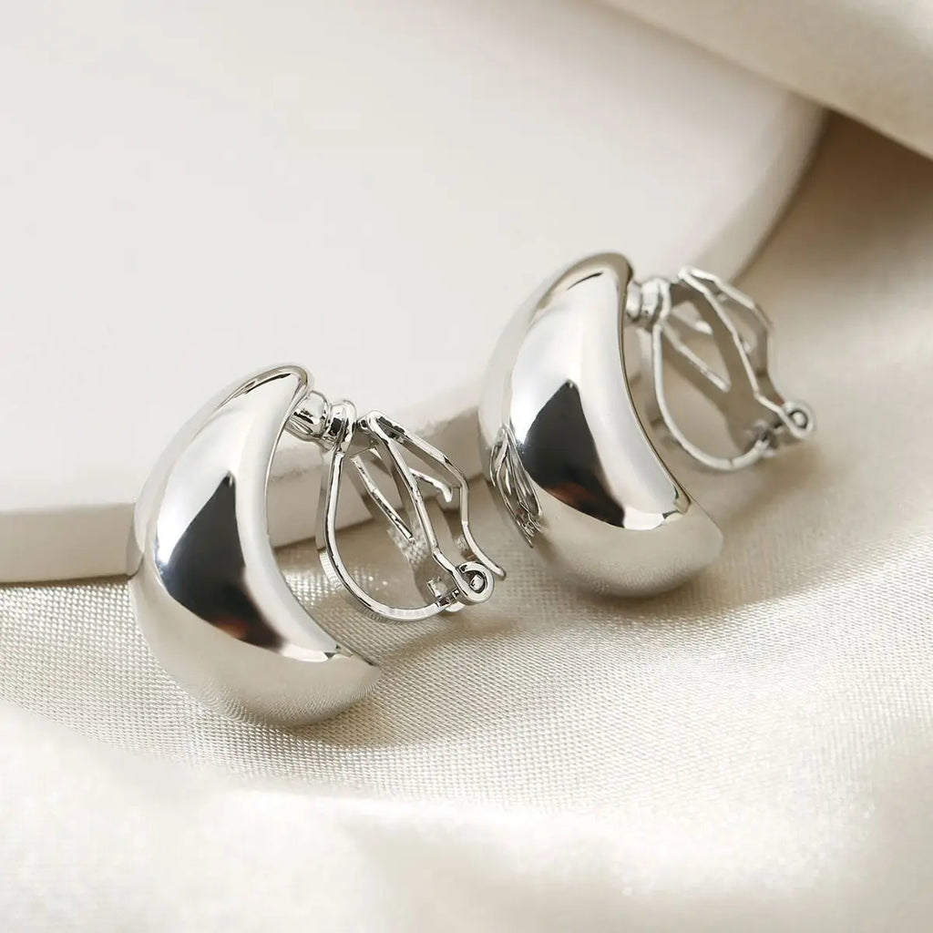 Envy NYC Envy NYC Luxury Droplet Zinc Clip-On Earings — Envy NYC branding close-up