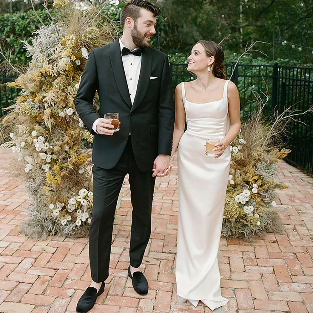 Envy NYC Envy NYC Belle Open Back Draped Satin Sheath Wedding Gown — lifestyle worn / used context