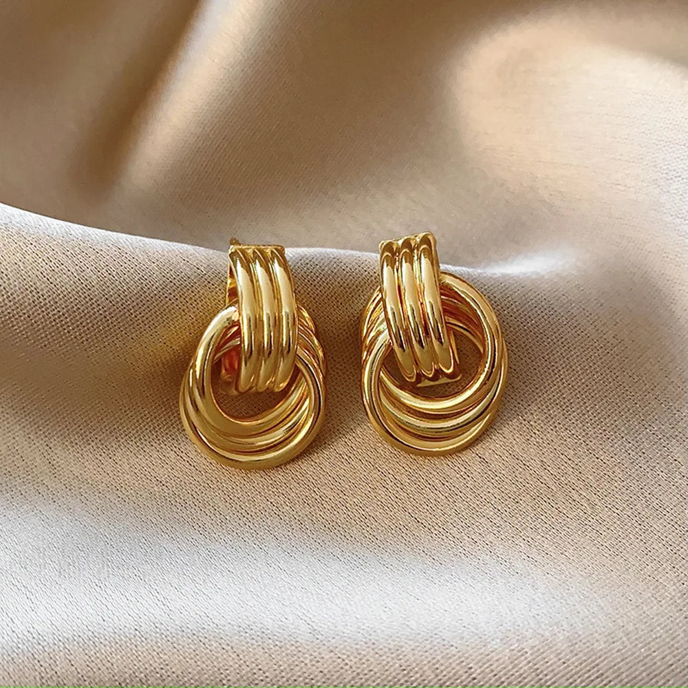 SORI STYLE Three-Layer Textured Knot Earrings for Women — in-use photo