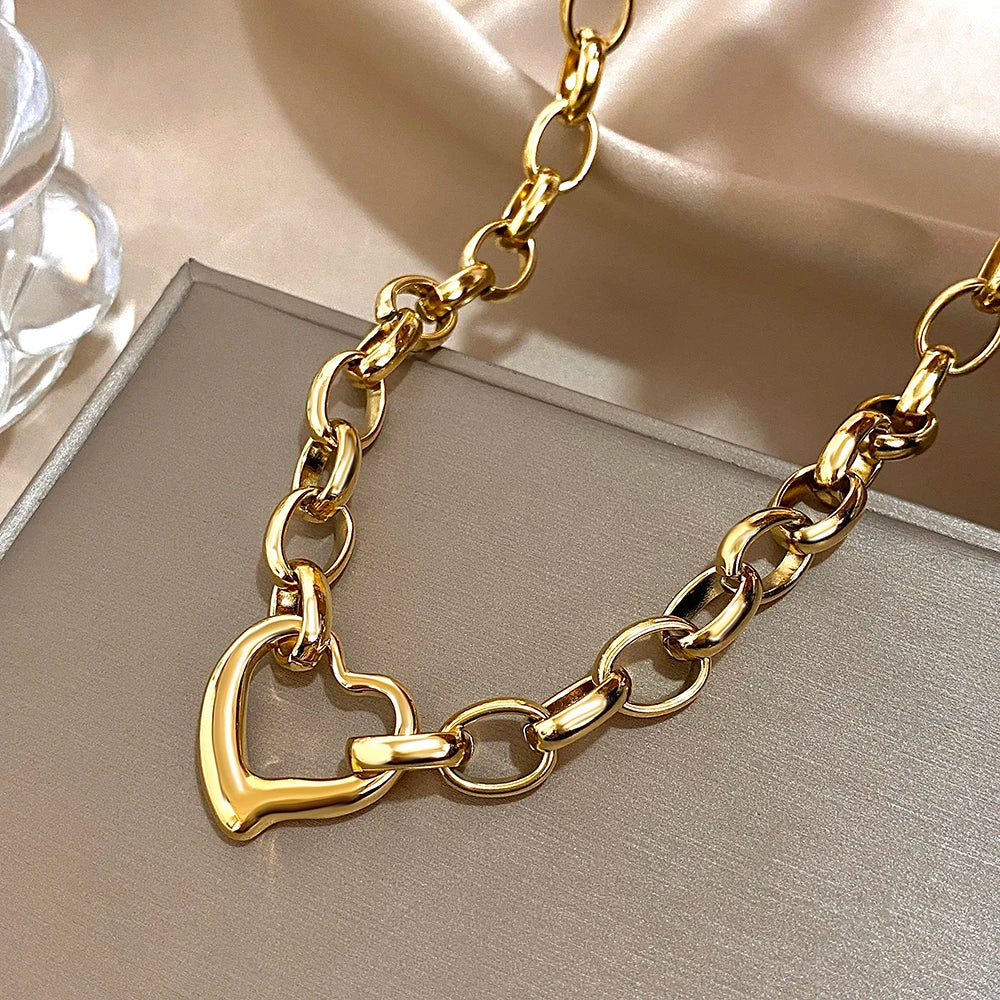 MyClosetAid Golden Stainless Steel Irregular Hollow Heart Pendant Necklace — in-use photo