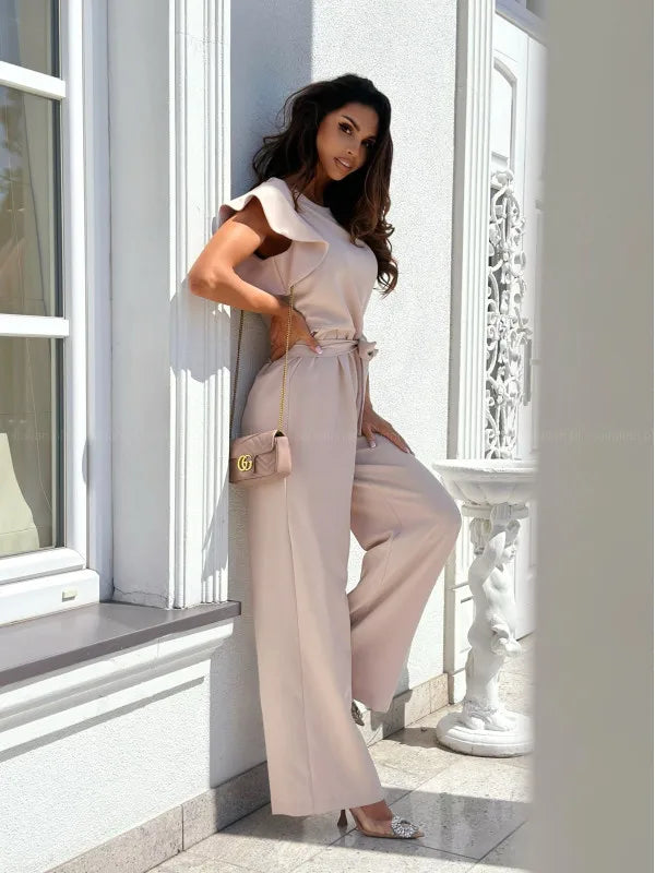 Envy NYC Envy NYC Summer Short Sleeve Wide Leg Jumpsuit — Envy NYC branding close-up