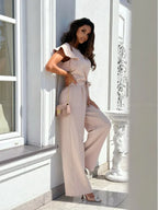 Envy NYC Envy NYC Summer Short Sleeve Wide Leg Jumpsuit — Envy NYC branding close-up