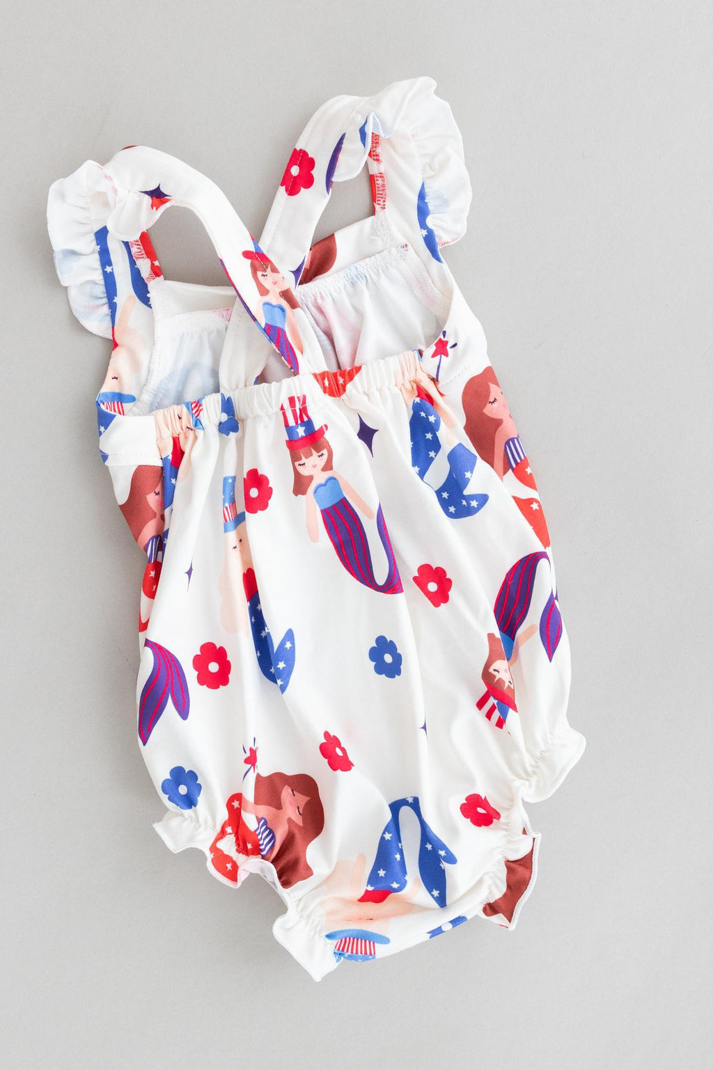 Mila & Rose ® SALE Mer-Made in the USA Ruffle Cross Back Romper — detail close-up