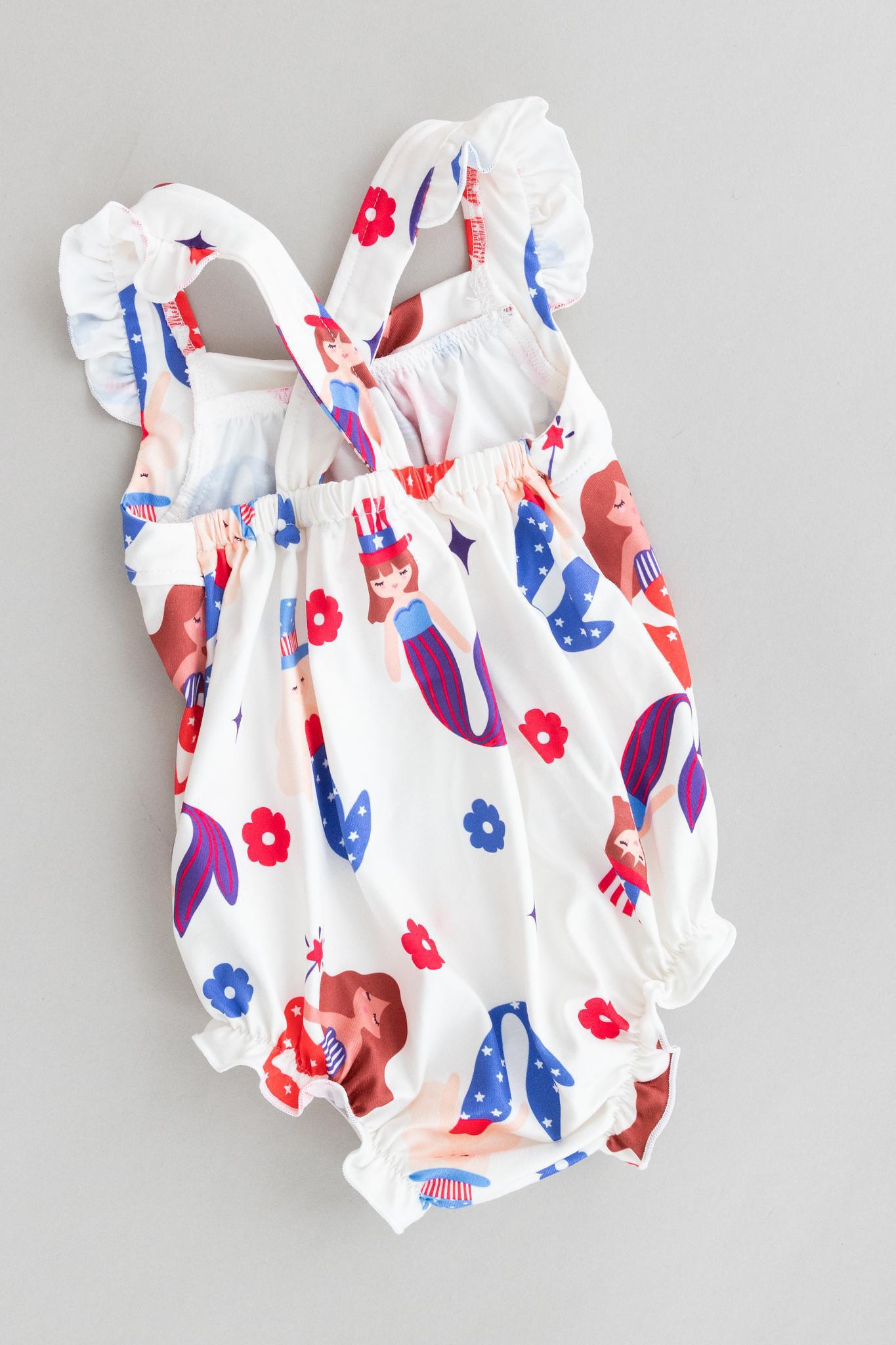 Mila & Rose ® SALE Mer-Made in the USA Ruffle Cross Back Romper — detail close-up