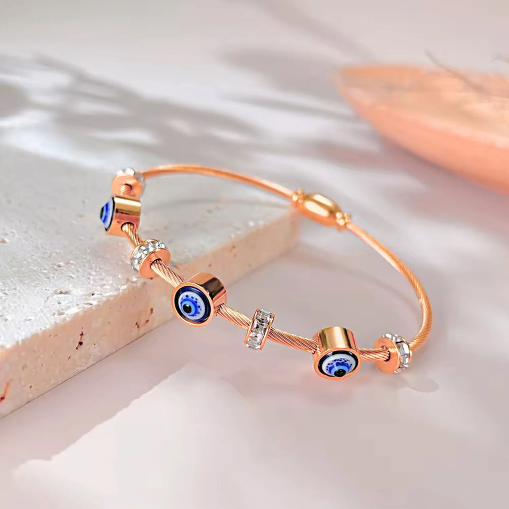 SORI STYLE Rose Gold Evil Eye Bangle Bracelet — detail close-up