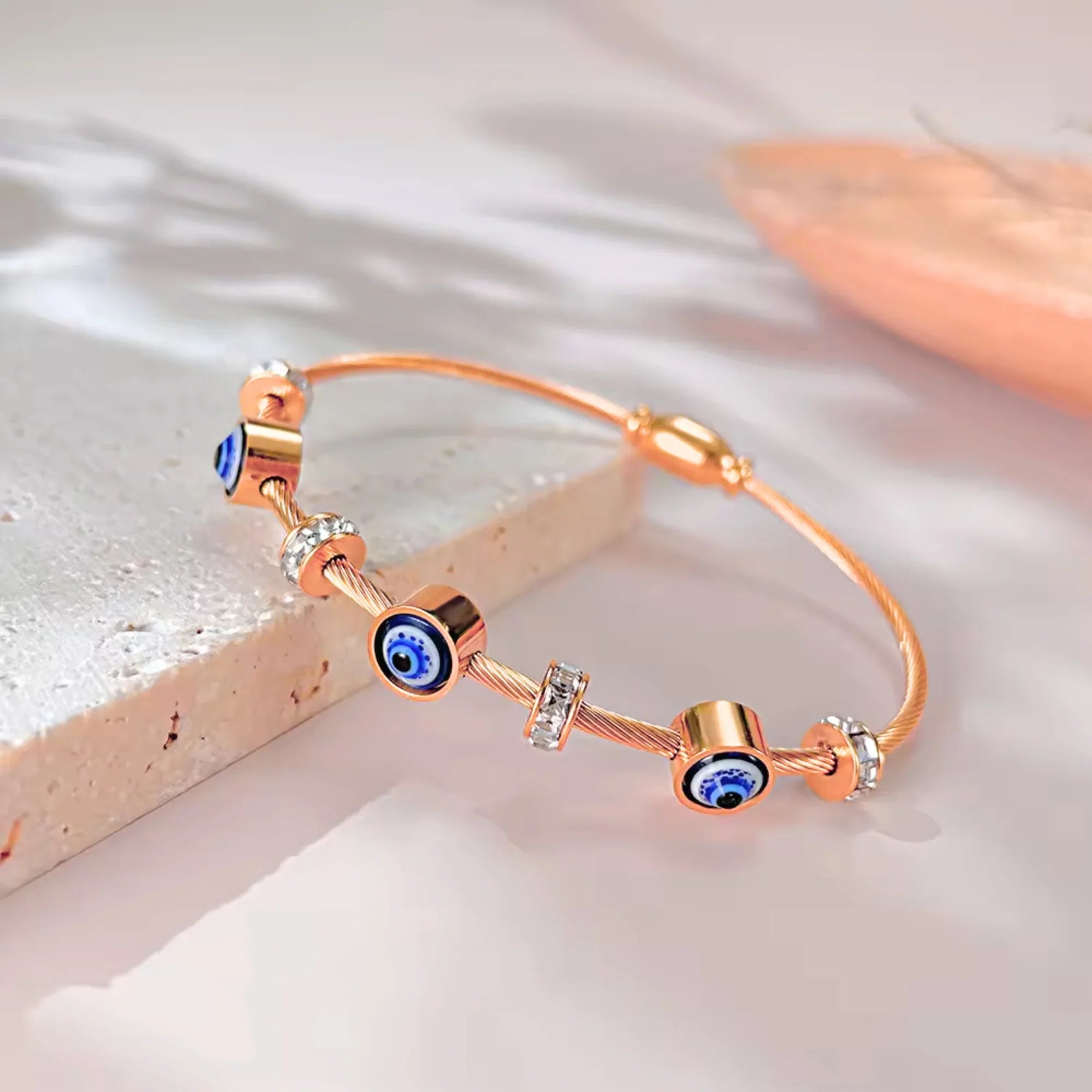 SORI STYLE Rose Gold Evil Eye Bangle Bracelet — detail close-up