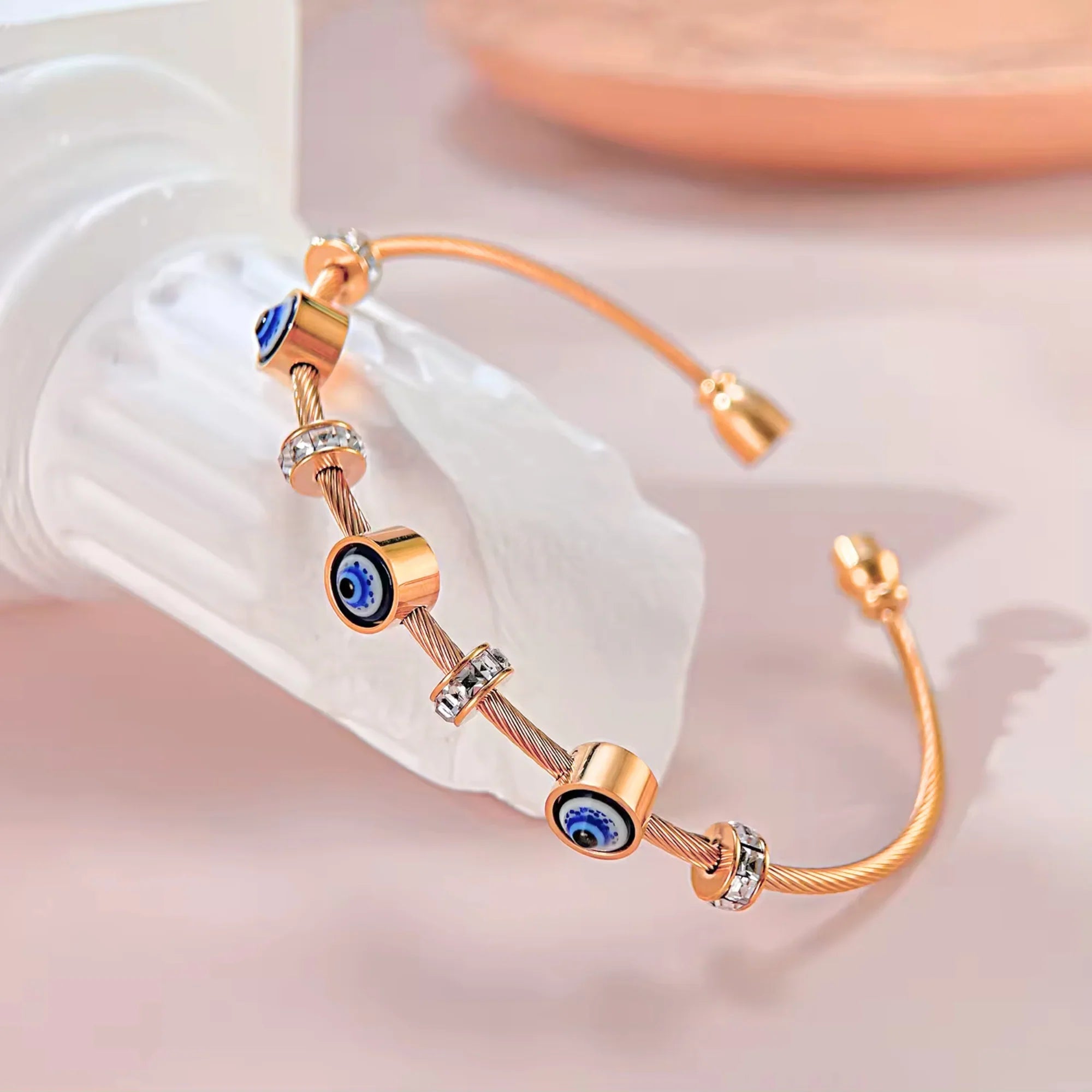 SORI STYLE Rose Gold Evil Eye Bangle Bracelet — lifestyle context