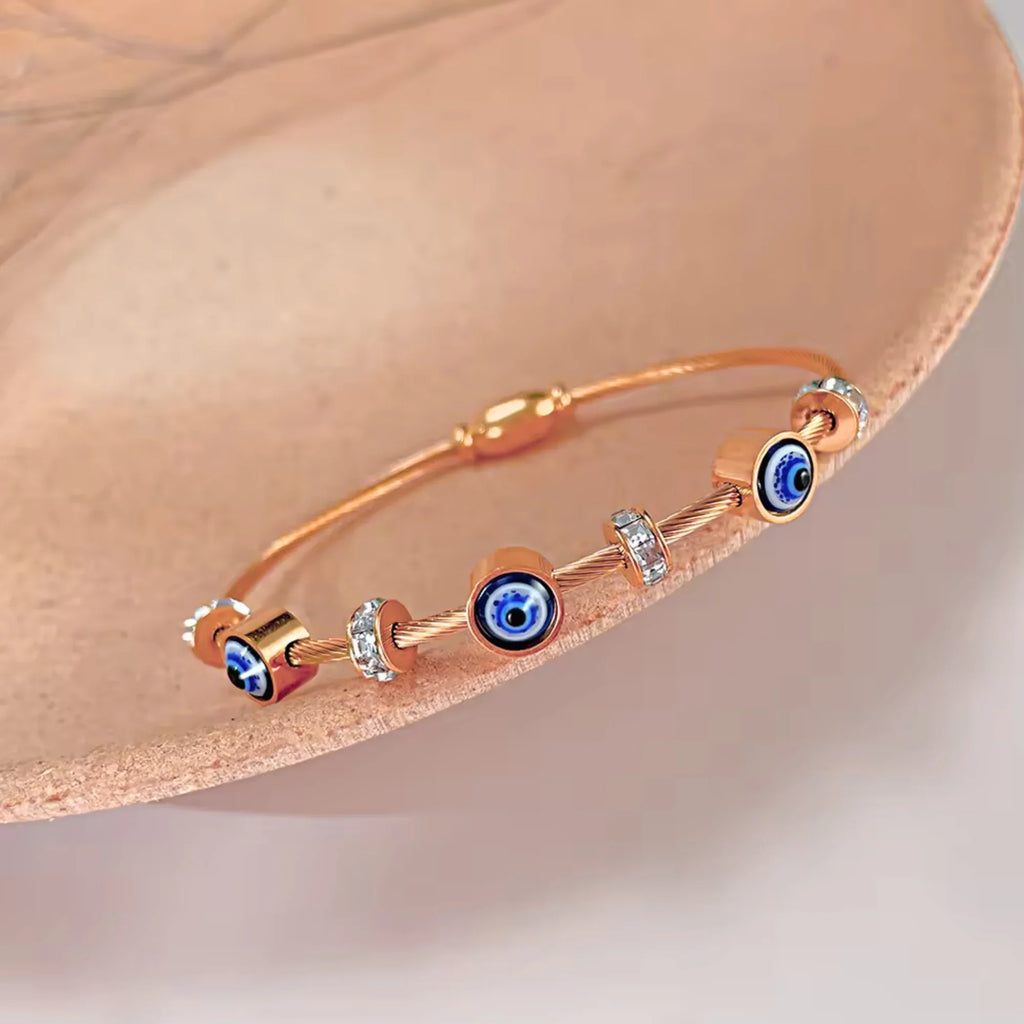 SORI STYLE Rose Gold Evil Eye Bangle Bracelet — side view