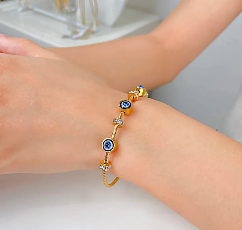 SORI STYLE Golden Evil Eye Cable Bracelet — lifestyle context