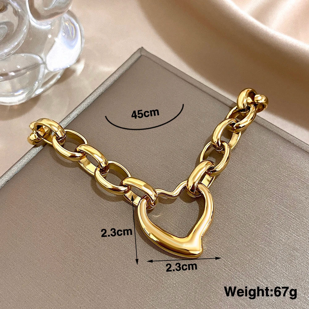 MyClosetAid Golden Stainless Steel Irregular Hollow Heart Pendant Necklace — detail close-up