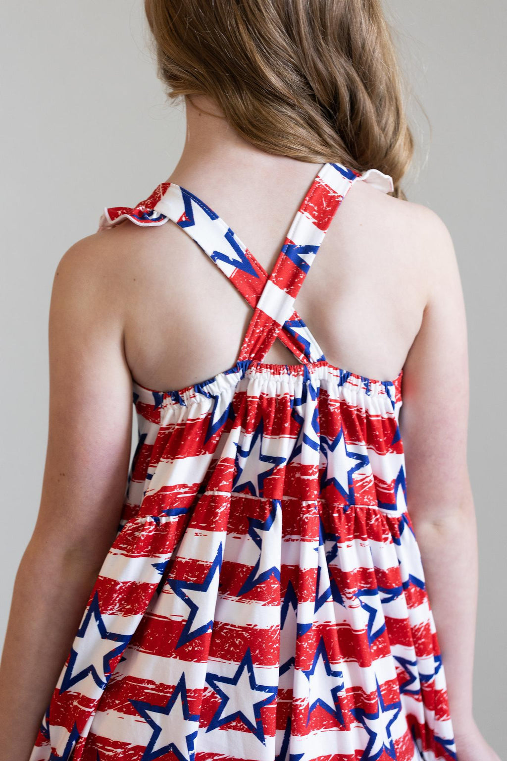 Mila & Rose ® Stars & Stripes Ruffle Cross Back Dress — lifestyle context