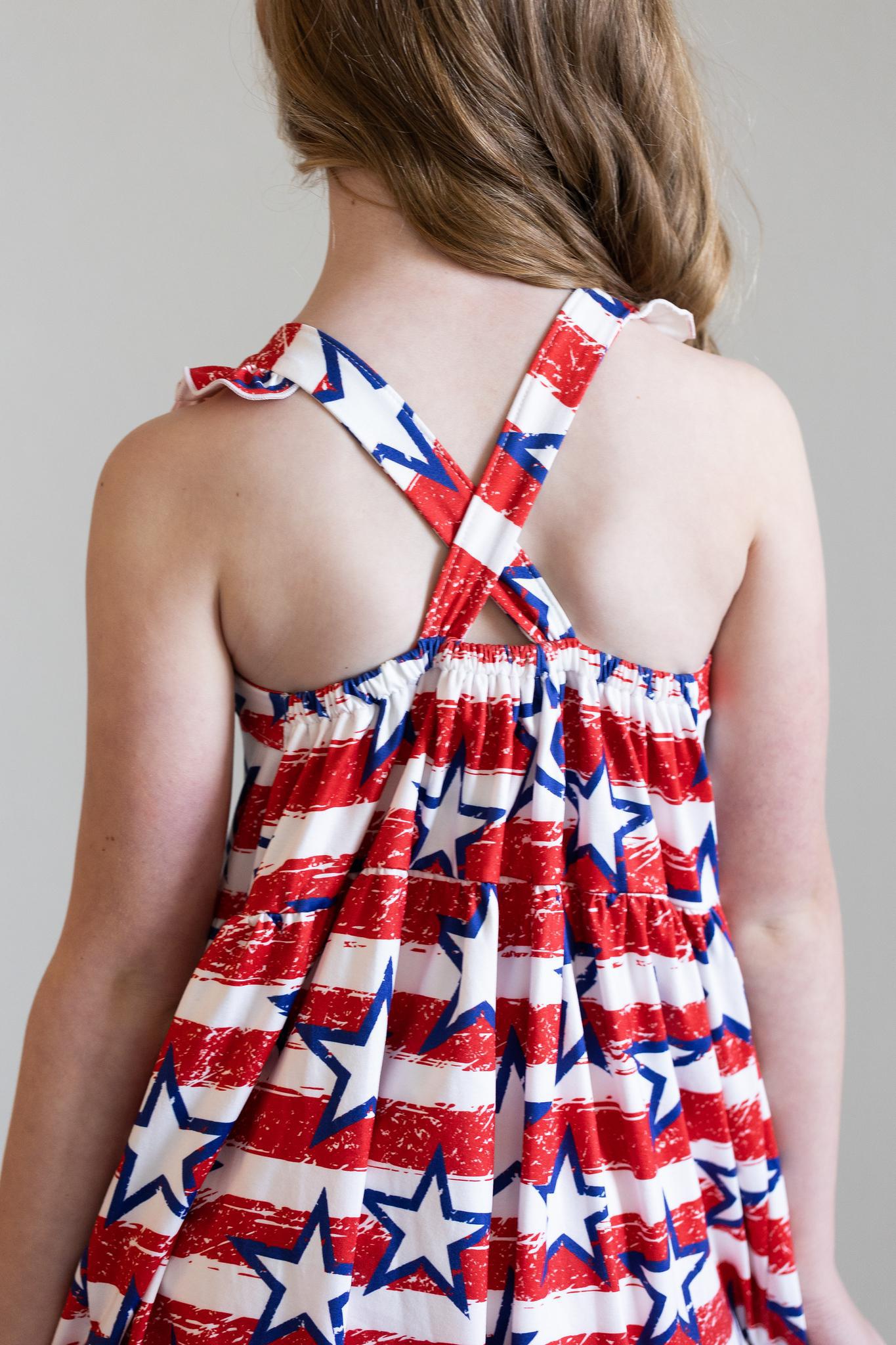 Mila & Rose ® Stars & Stripes Ruffle Cross Back Dress — lifestyle context
