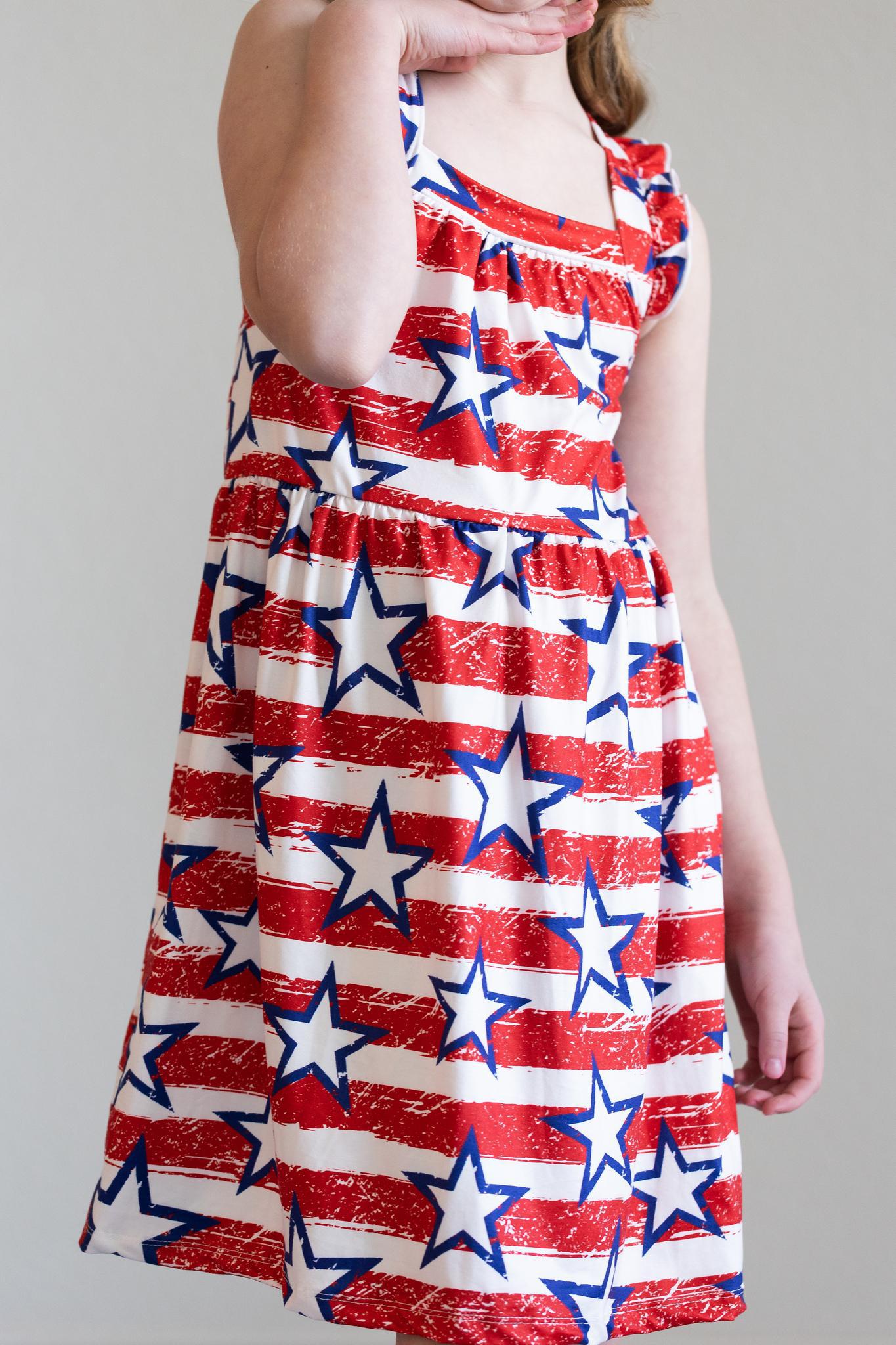 Mila & Rose ® Stars & Stripes Ruffle Cross Back Dress — side view