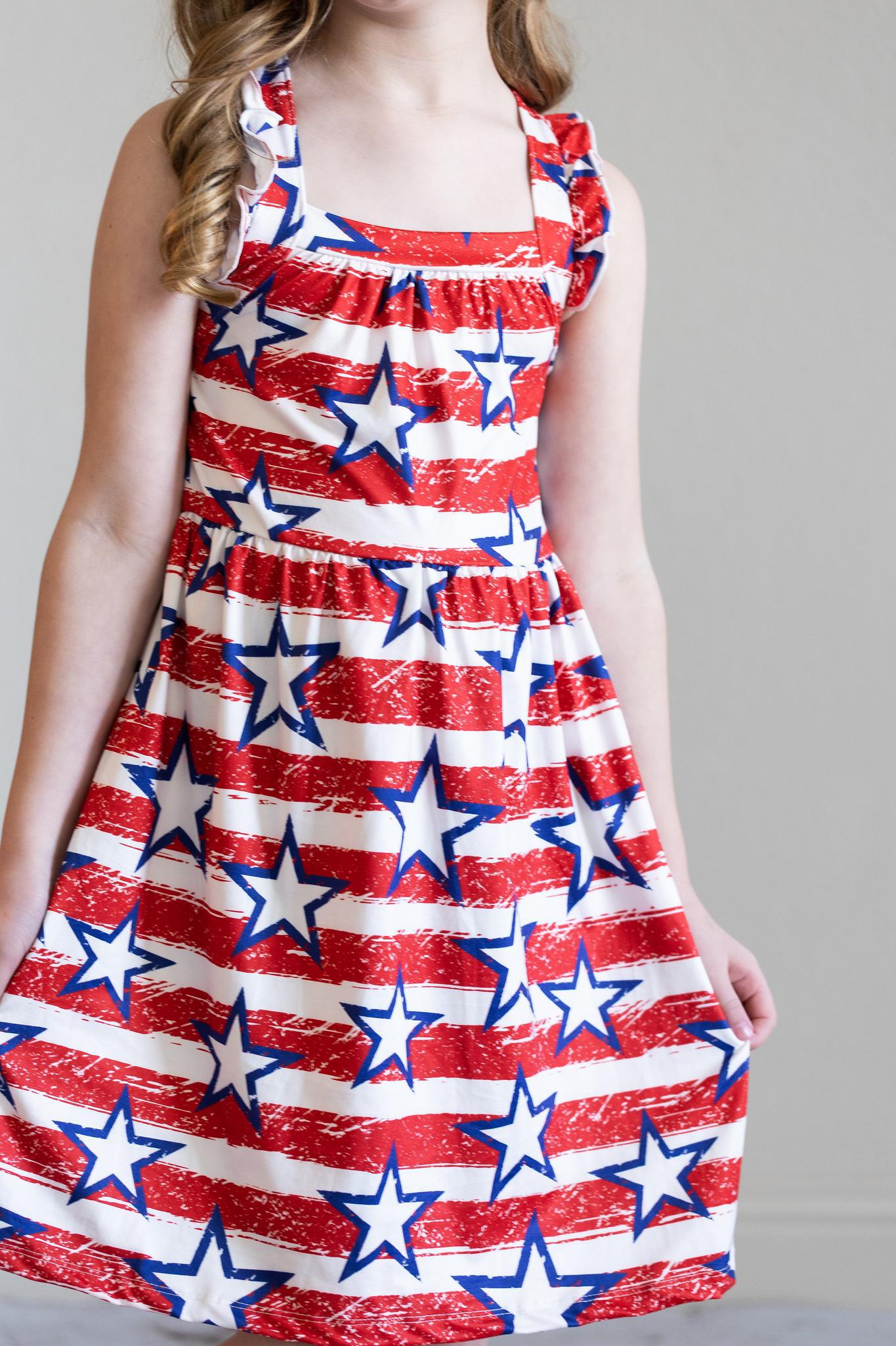 Mila & Rose ® Stars & Stripes Ruffle Cross Back Dress — back view