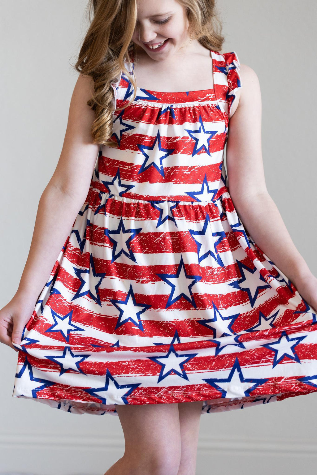 Mila & Rose ® Stars & Stripes Ruffle Cross Back Dress — in-use photo