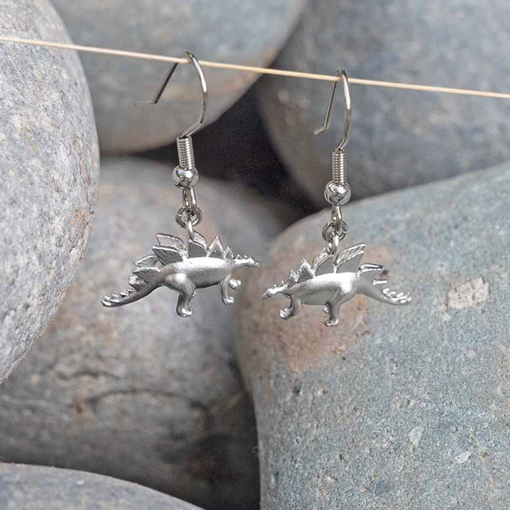 Princess Awesome & Boy Wonder Pteradactyl & Stegosaurus Earrings — lifestyle worn / used context
