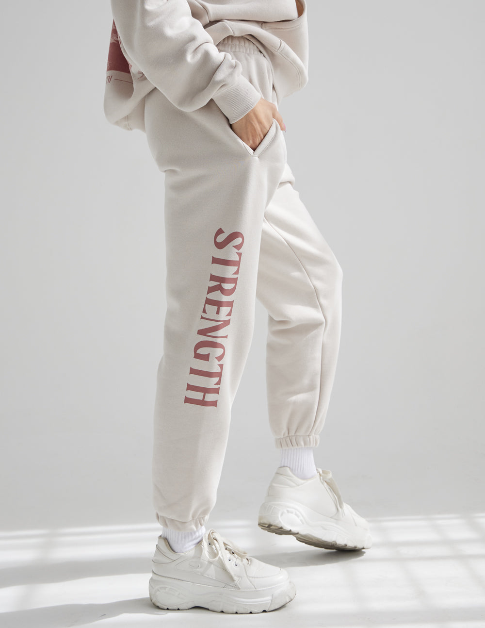 Elevated Faith Strength Unisex Sweatpant — Elevated Faith branding close-up