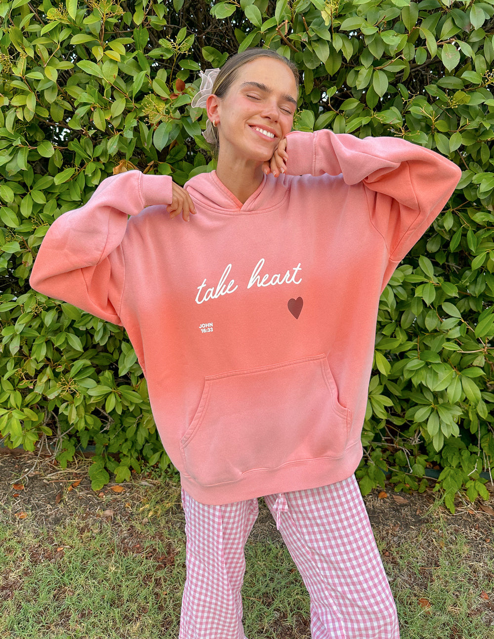 Elevated Faith Take Heart Unisex Hoodie — Elevated Faith branding close-up