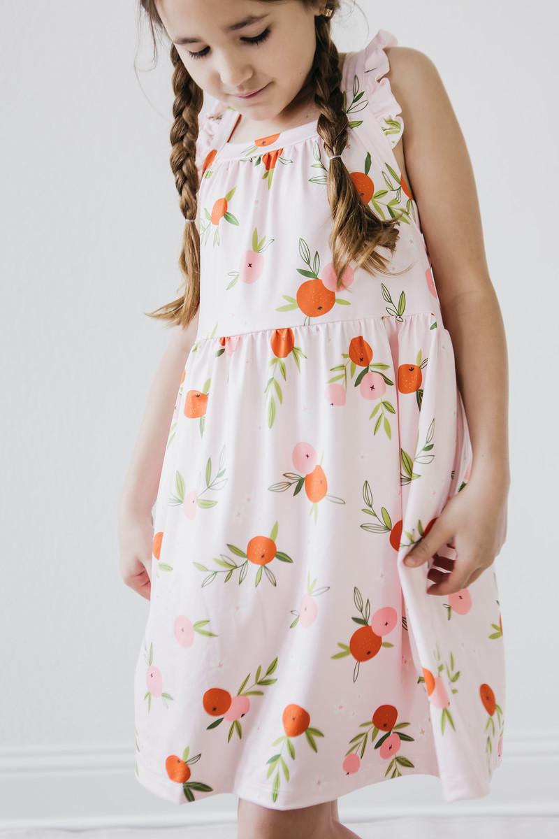 Mila & Rose ® Tangerine Ruffle Cross Back Dress — side view