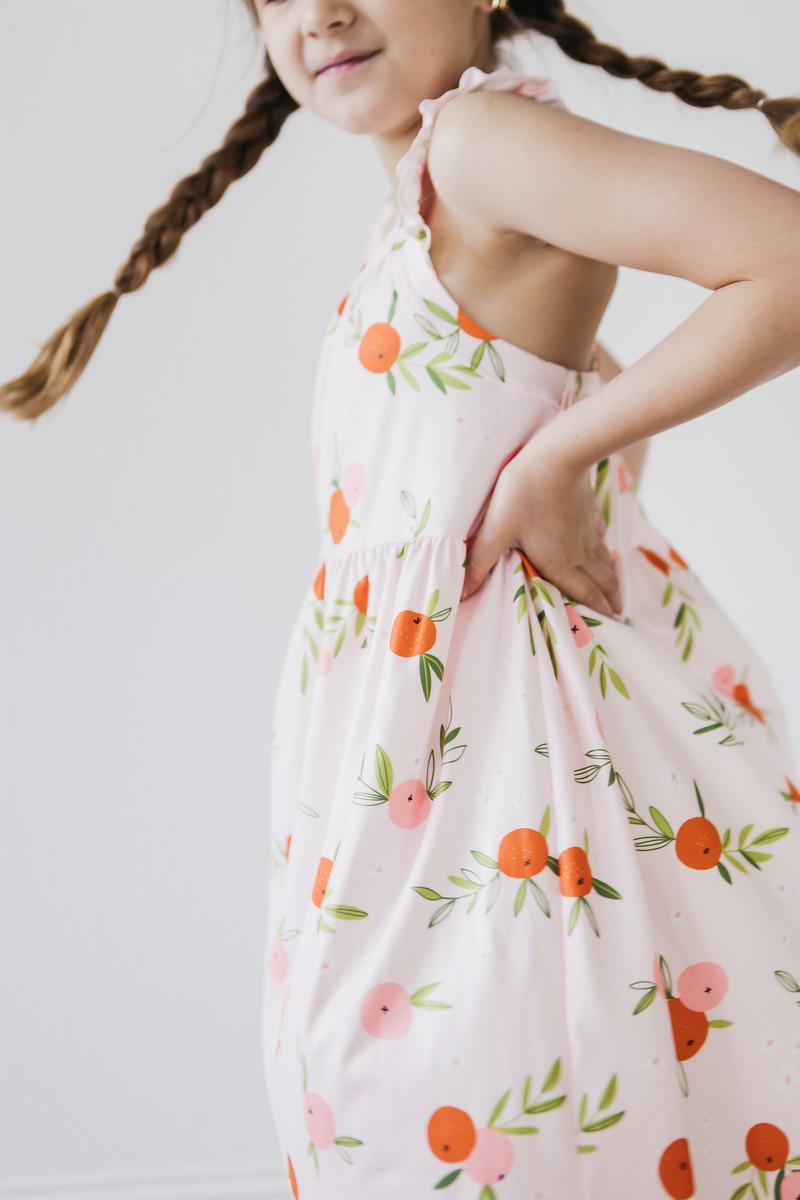 Mila & Rose ® Tangerine Ruffle Cross Back Dress — back view