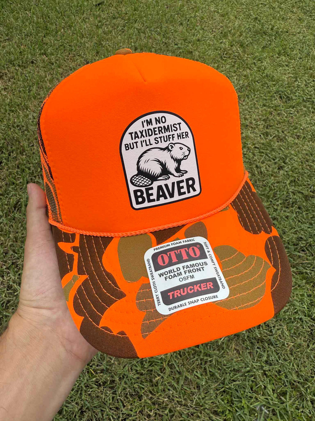 Luckless Outfitters Taxidermist Trucker Hat — flat-lay composition
